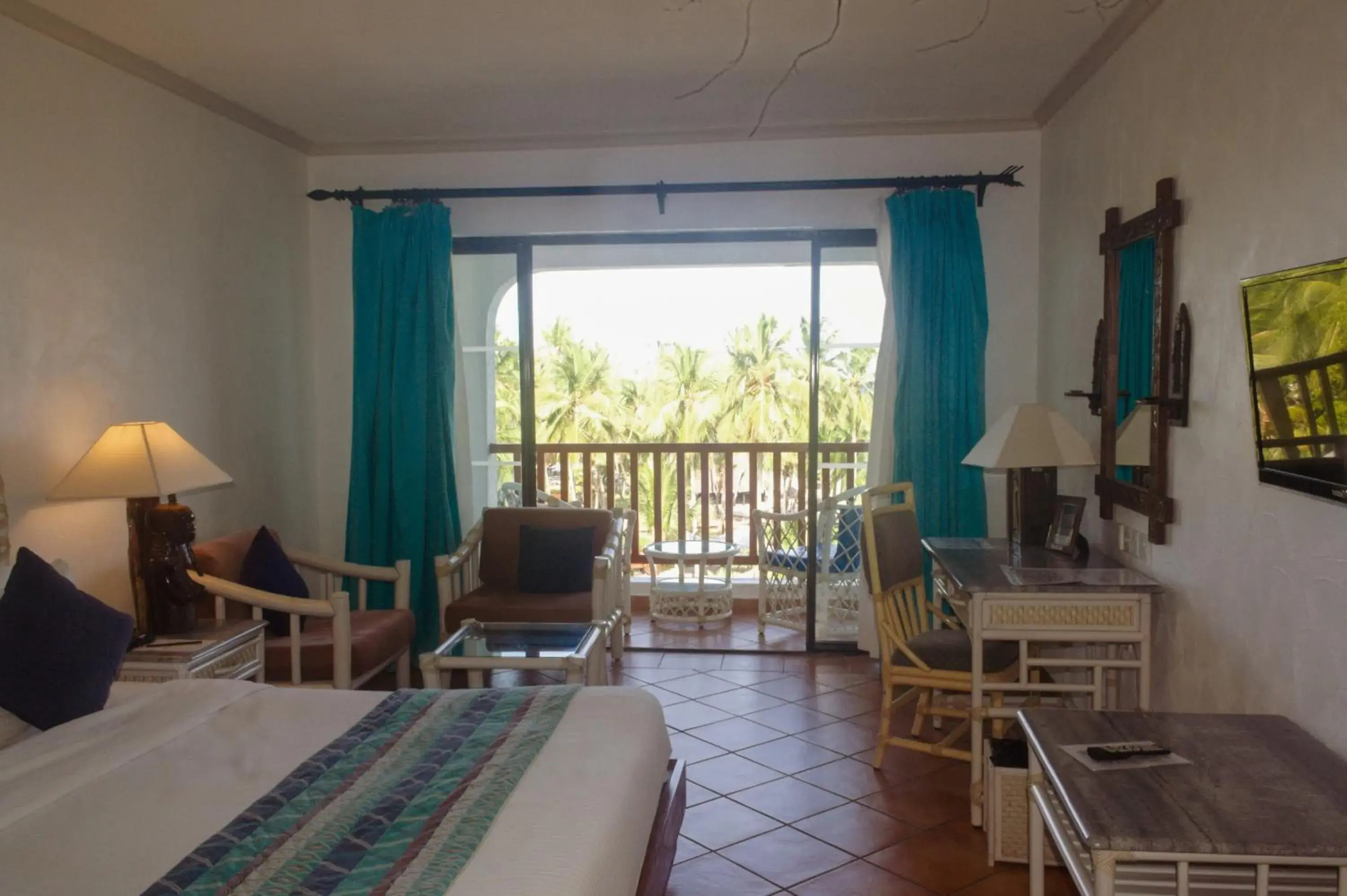 Photo of the whole room, Bed in Diani Reef Beach Resort & Spa - Your Beachfront Bliss Awaits Photo of the whole room, Bed in Diani Reef Beach Resort & Spa - Your Beachfront Bliss Awaits