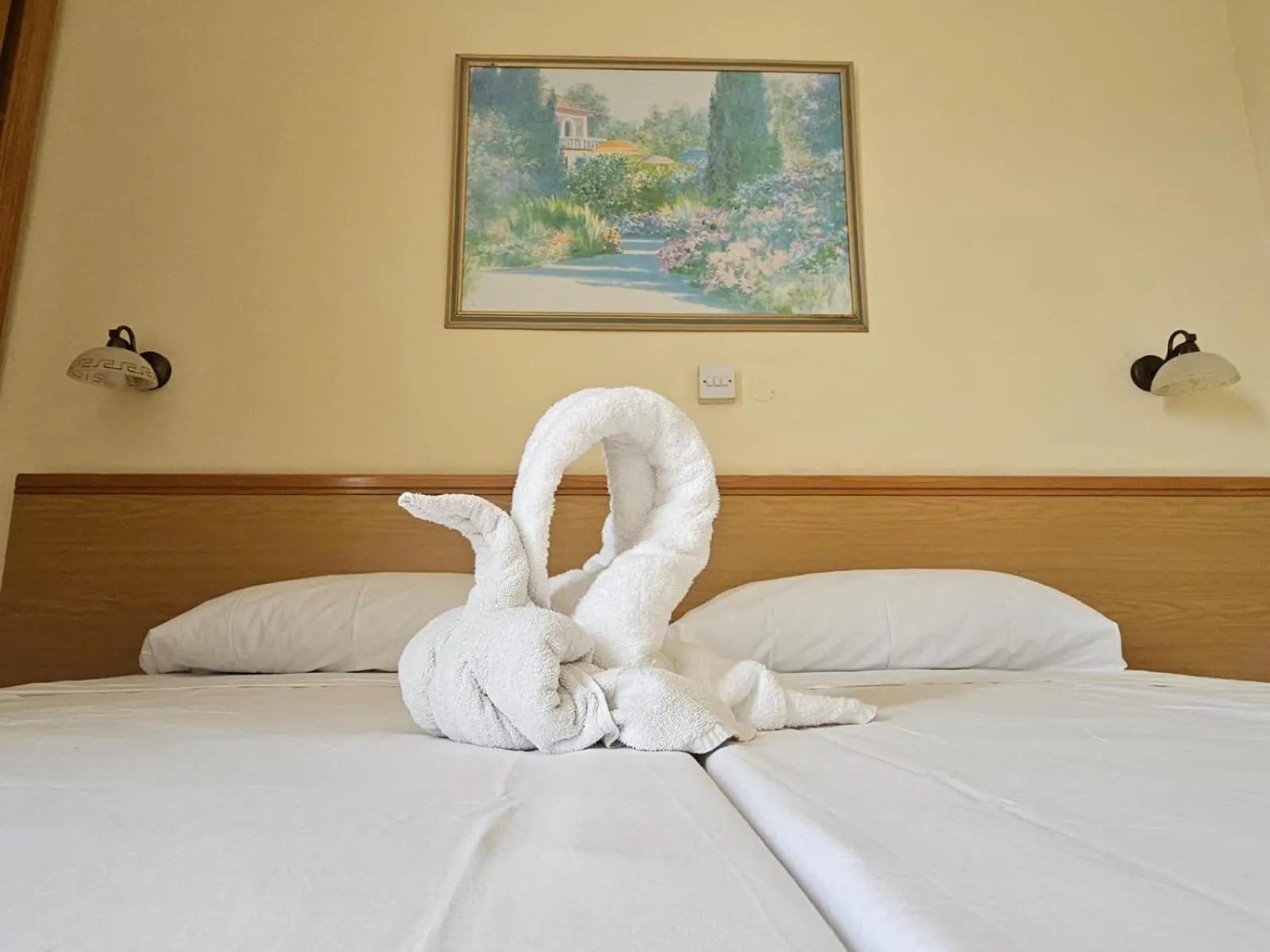 Bed in Ambassador Hotel