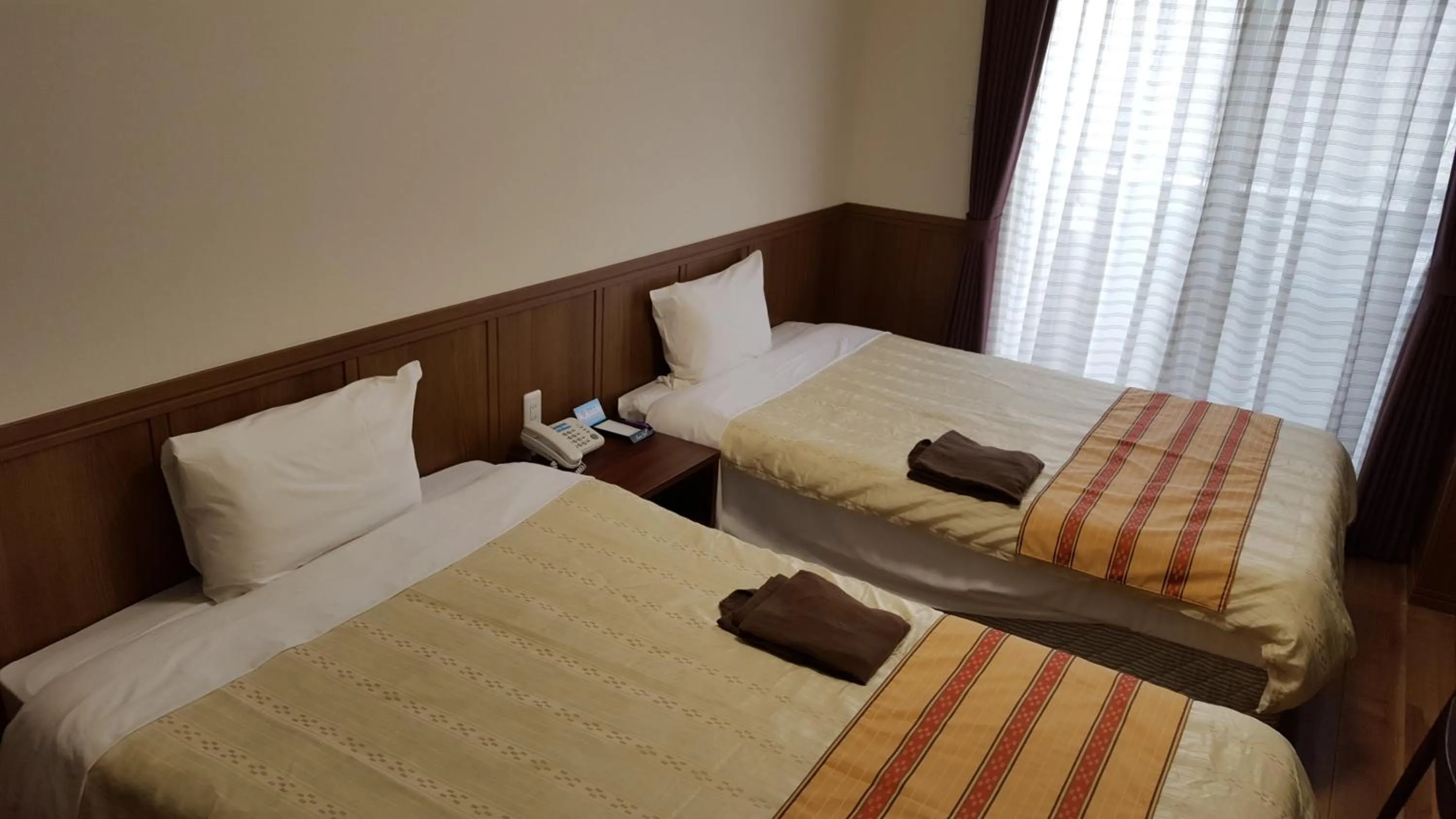 Bed in Hotel Peacely In Miyakojima Nexus