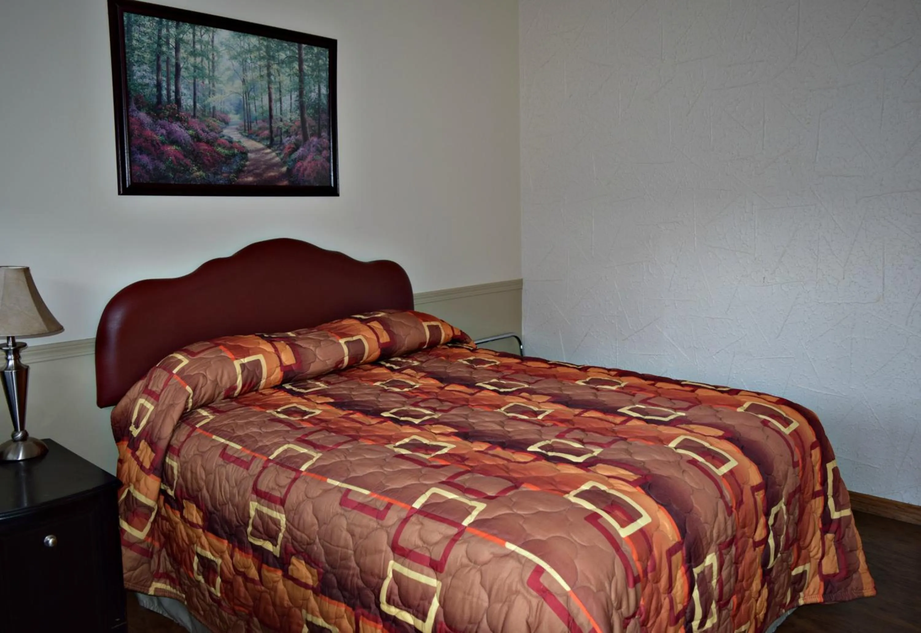 Bed in Centre Suite Inns Motel