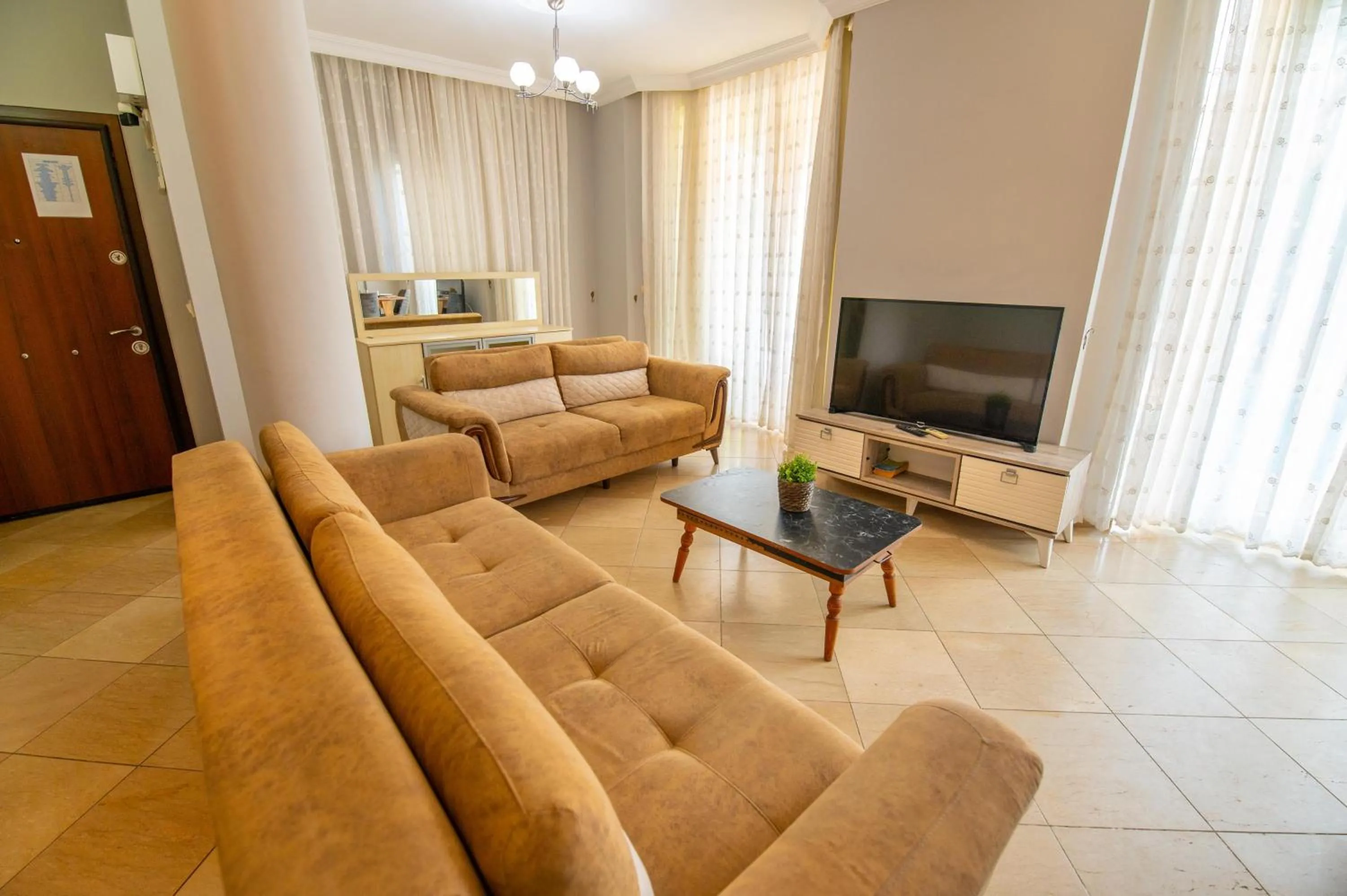 Communal lounge/ TV room in Sunset Beach Club Aqualettings Oyster 5
