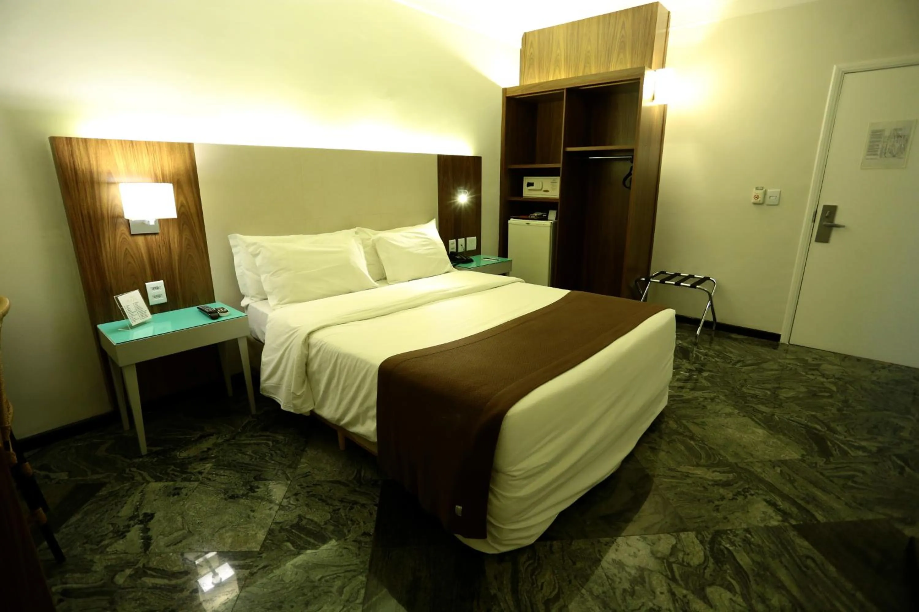 Bed in Oasis Plaza Hotel