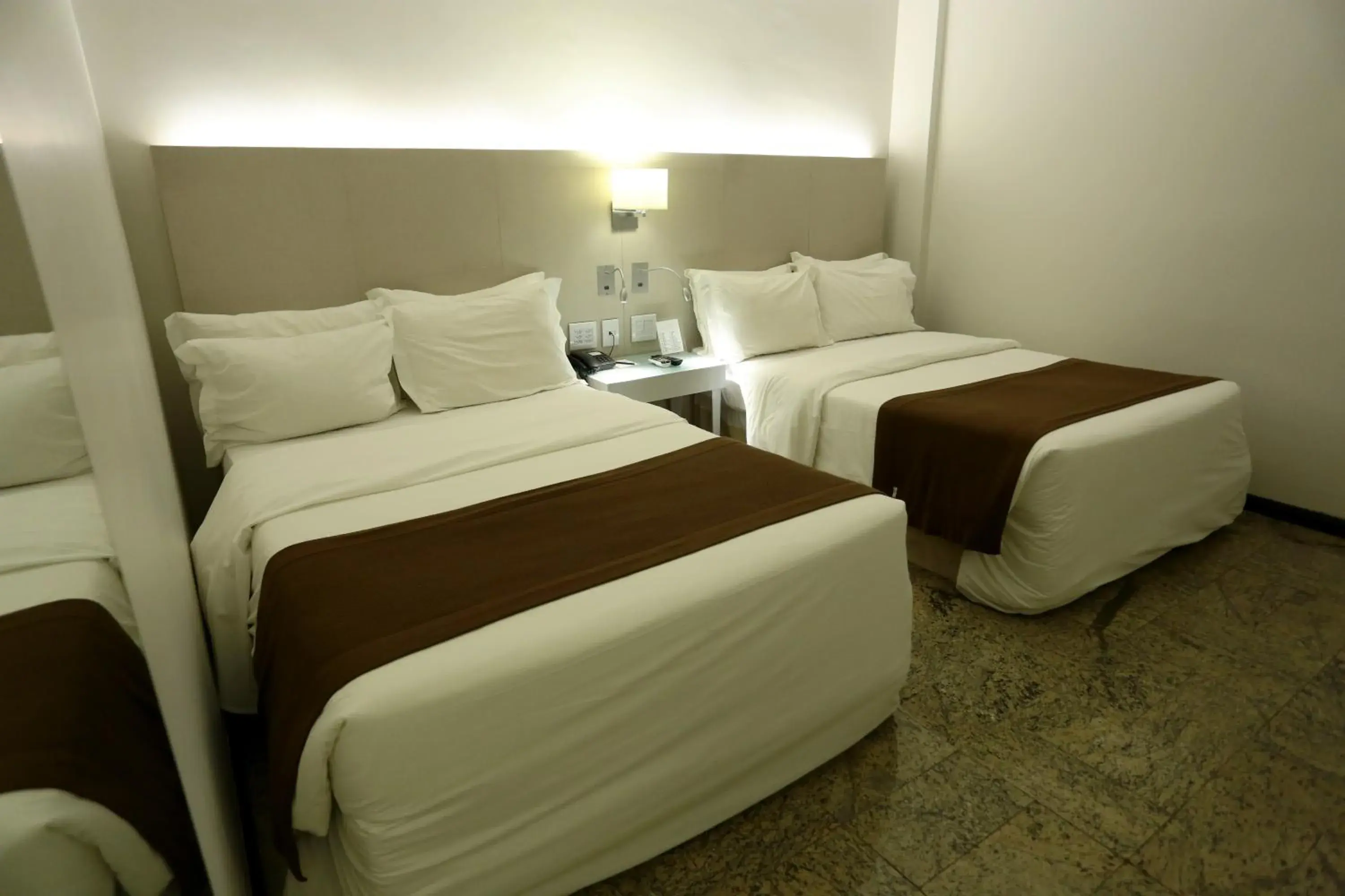 Bed in Oasis Plaza Hotel Bed in Oasis Plaza Hotel