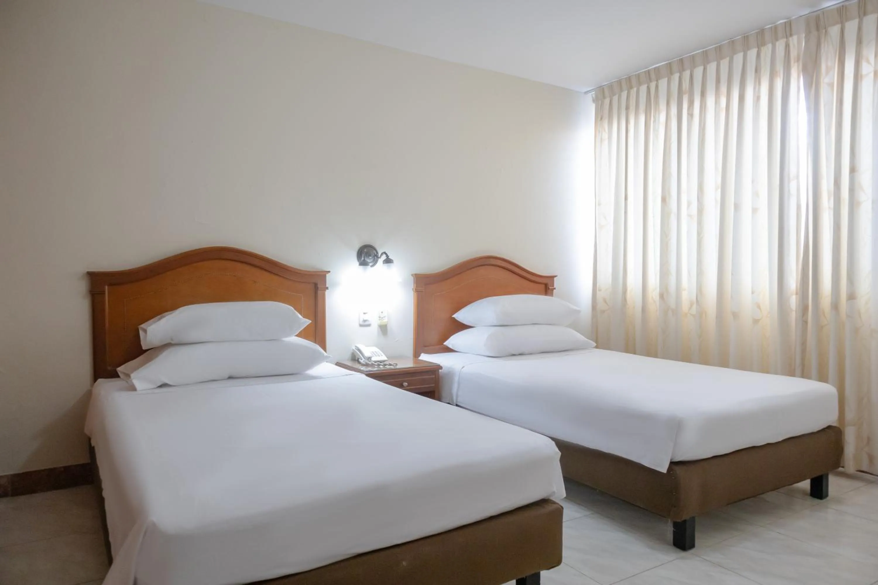 Bed in Hotel Faranda Bolivar Cucuta, a member of Radisson Individuals
