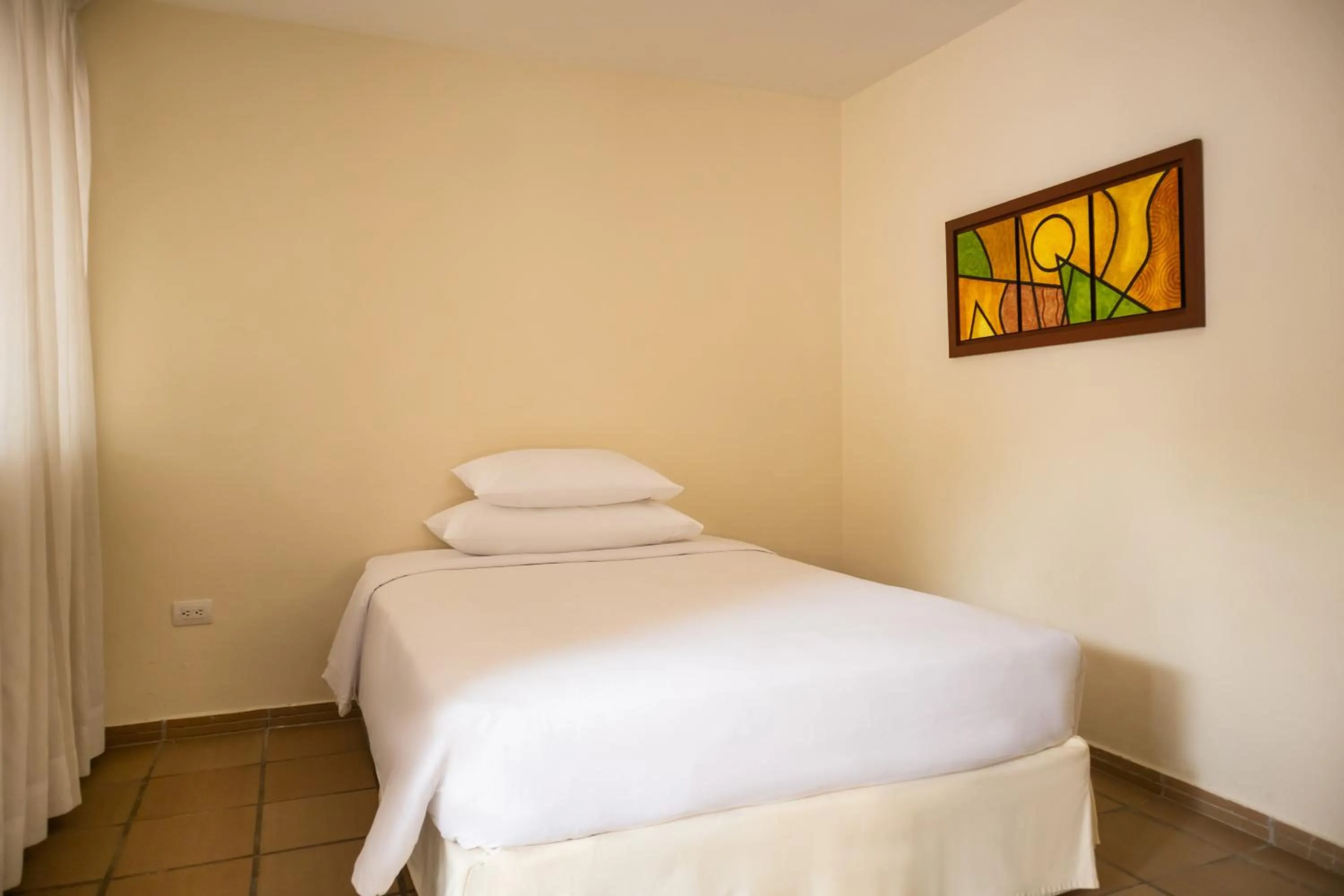 Bed in Hotel Faranda Bolivar Cucuta, a member of Radisson Individuals