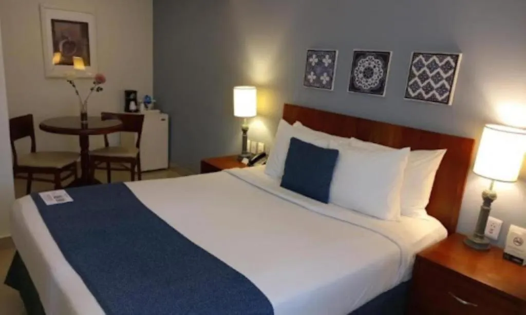 Photo of the whole room, Bed in Hodelpa Caribe Colonial