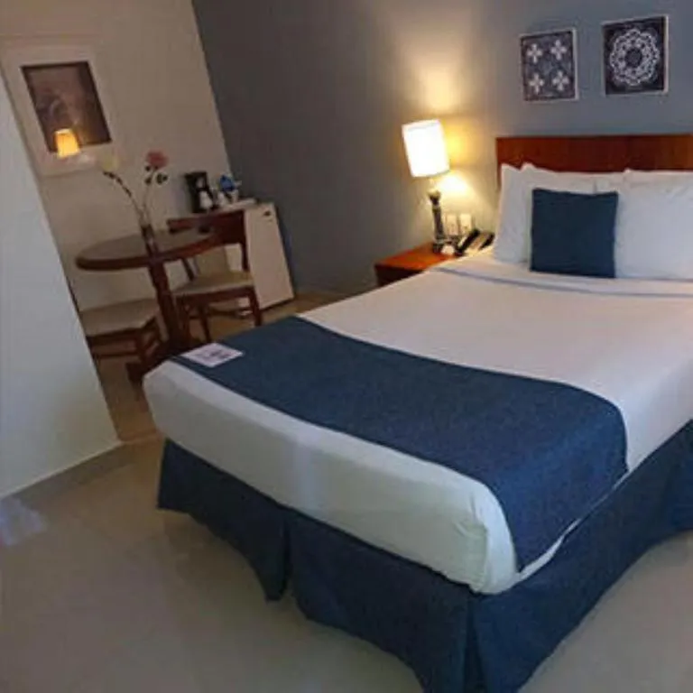 Photo of the whole room, Bed in Hodelpa Caribe Colonial