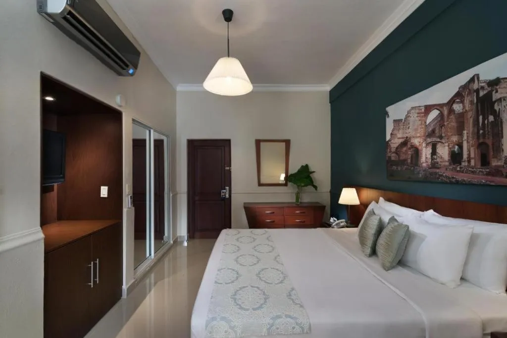 Photo of the whole room, Bed in Hodelpa Caribe Colonial