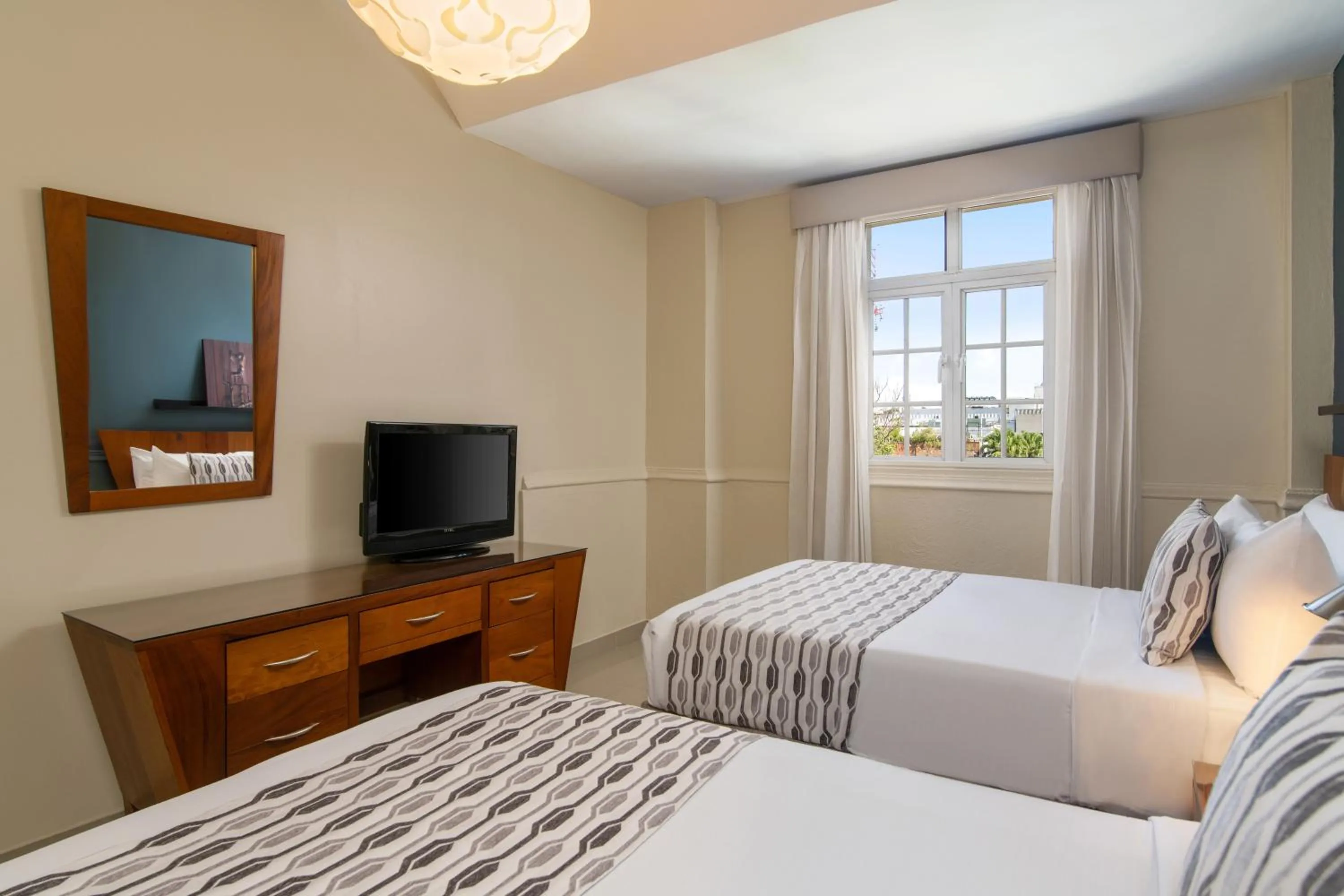 Bed in Hodelpa Caribe Colonial