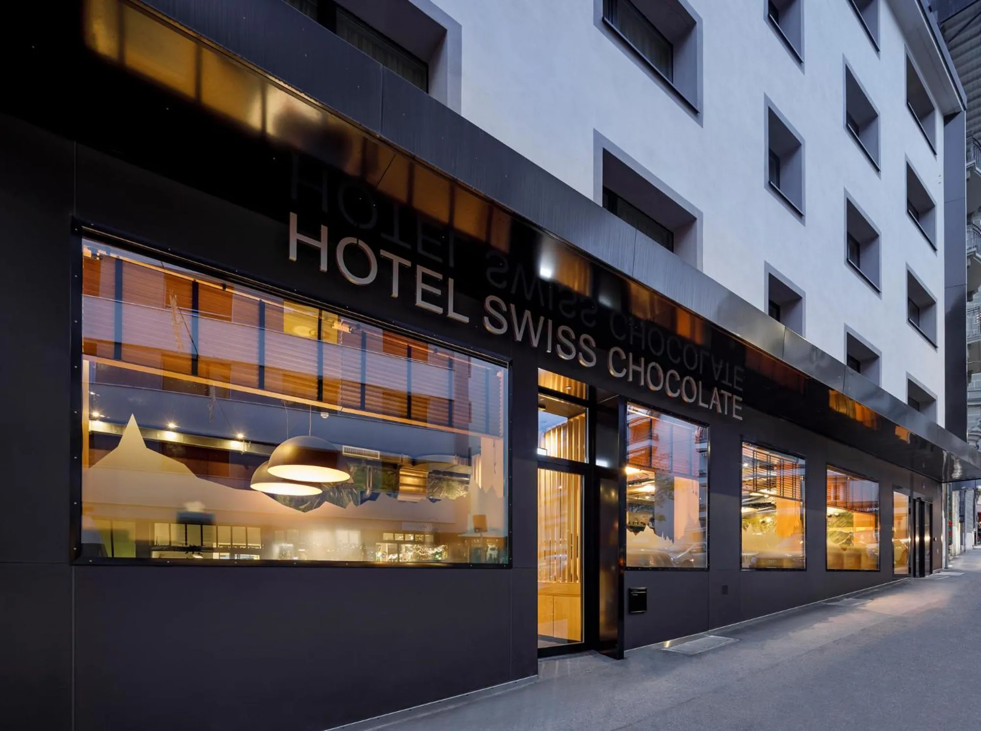 Property building in Swiss Chocolate by Fassbind Lausanne