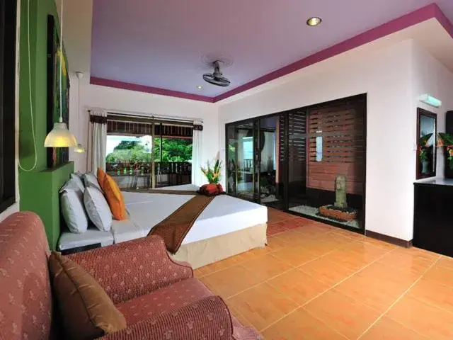 Bed in Koh Ngai Cliff Beach Resort Bed in Koh Ngai Cliff Beach Resort