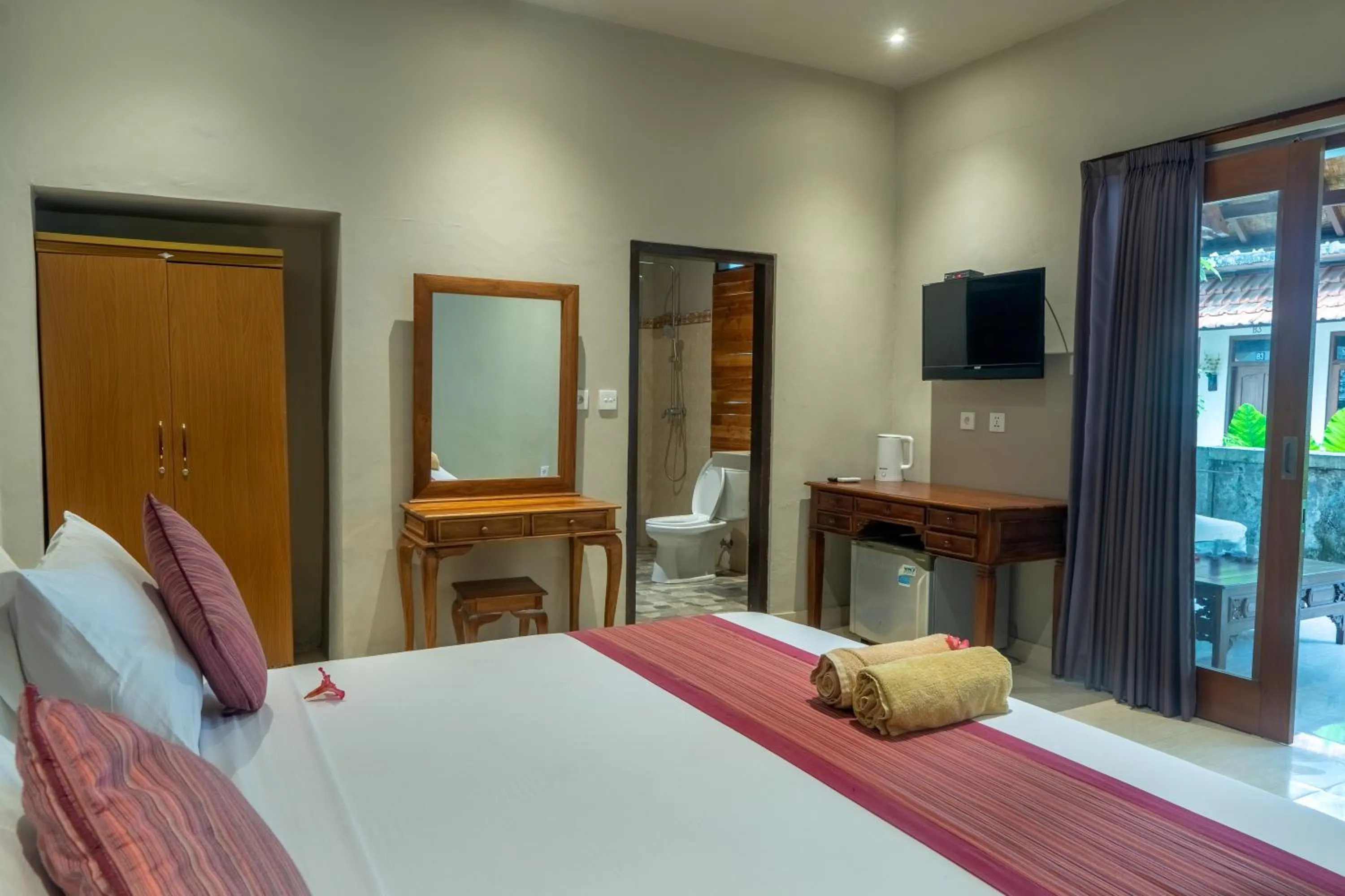 Bed in Warsa's Garden Bungalow and Spa