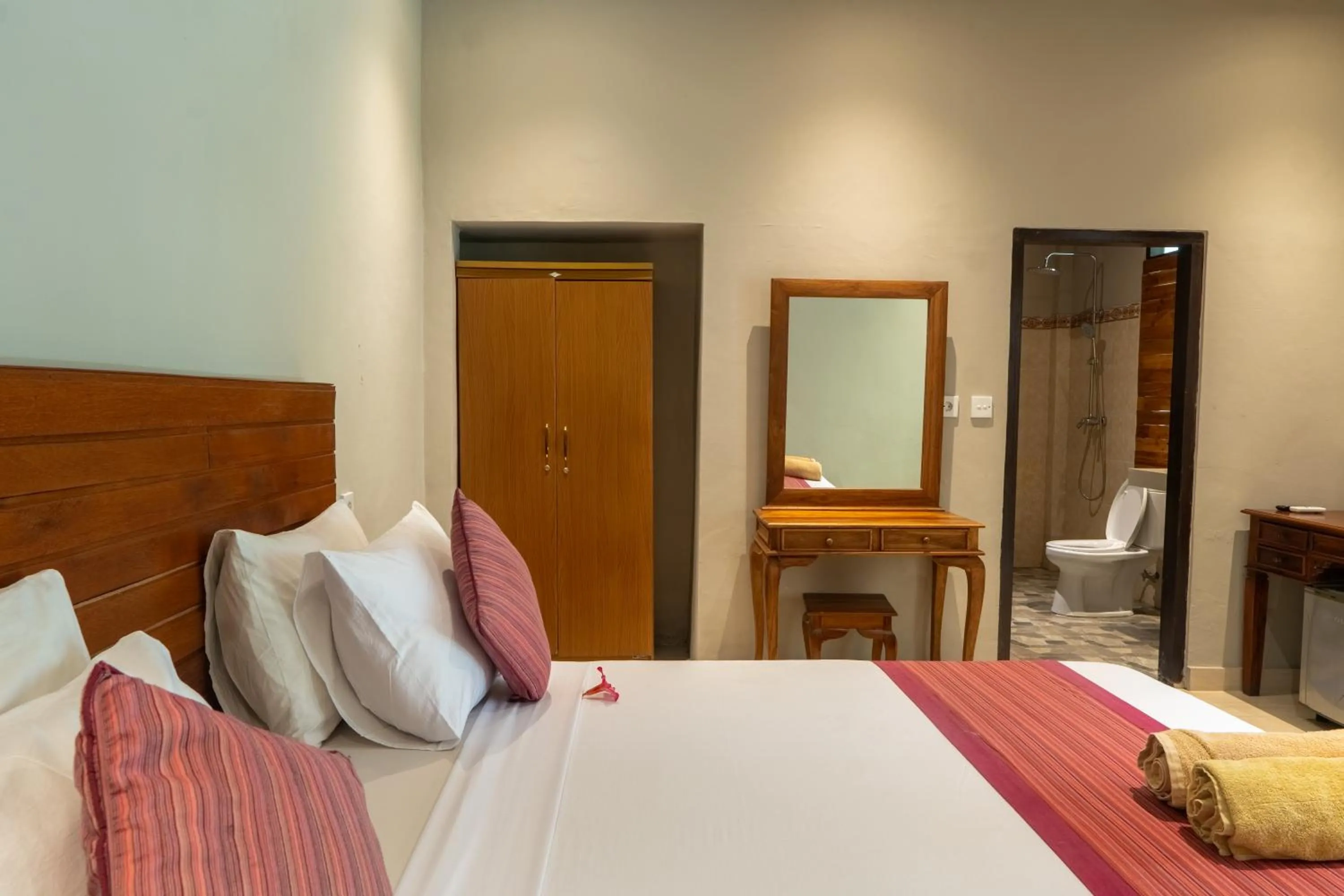 Bed in Warsa's Garden Bungalow and Spa