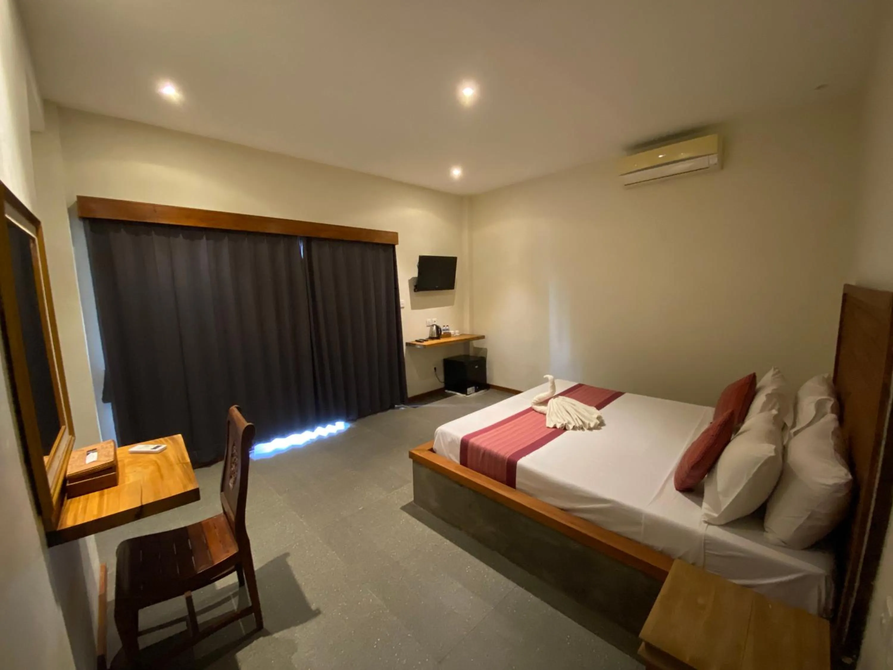 Bed in Warsa's Garden Bungalow and Spa