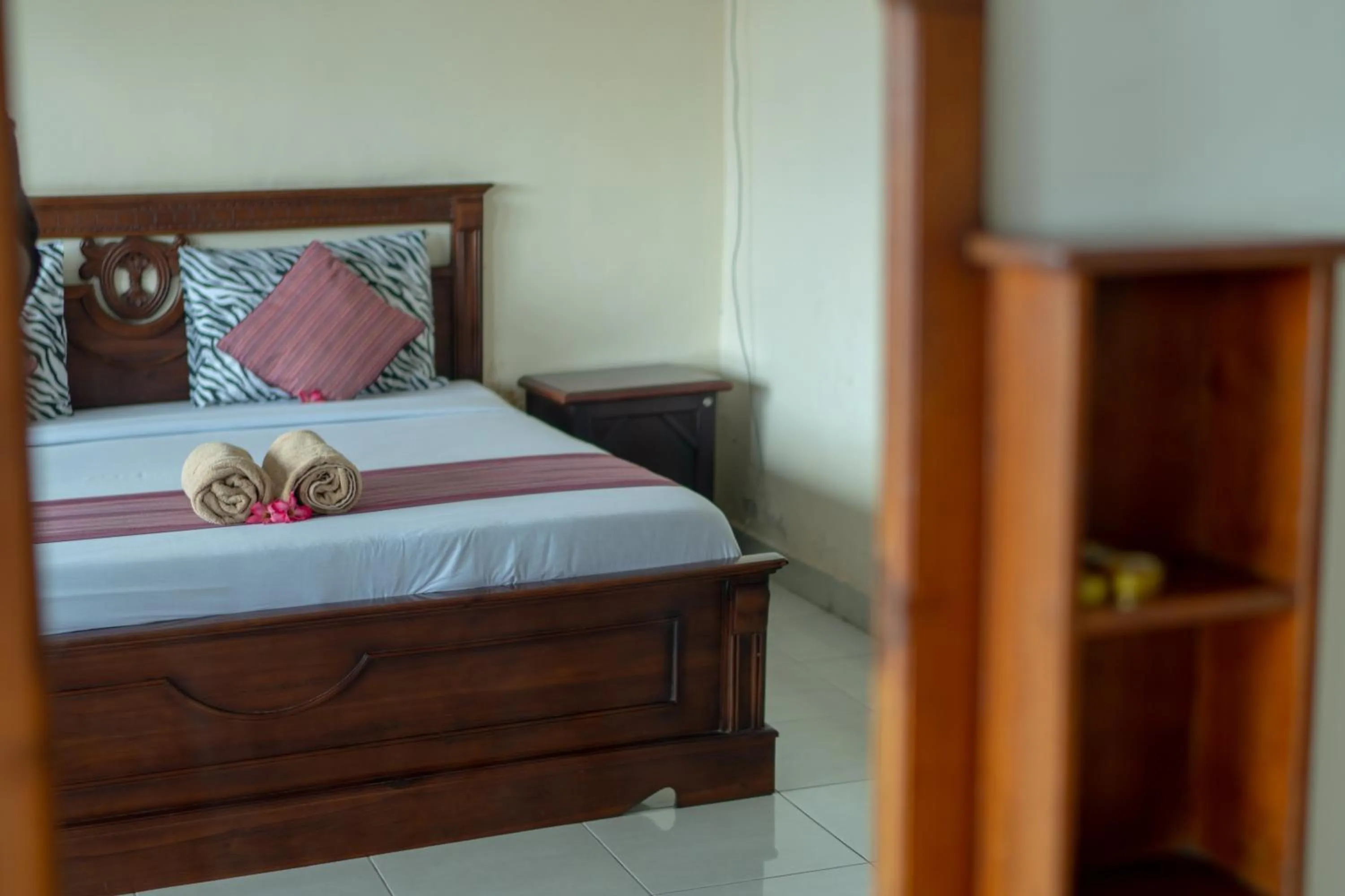 Bed in Warsa's Garden Bungalow and Spa