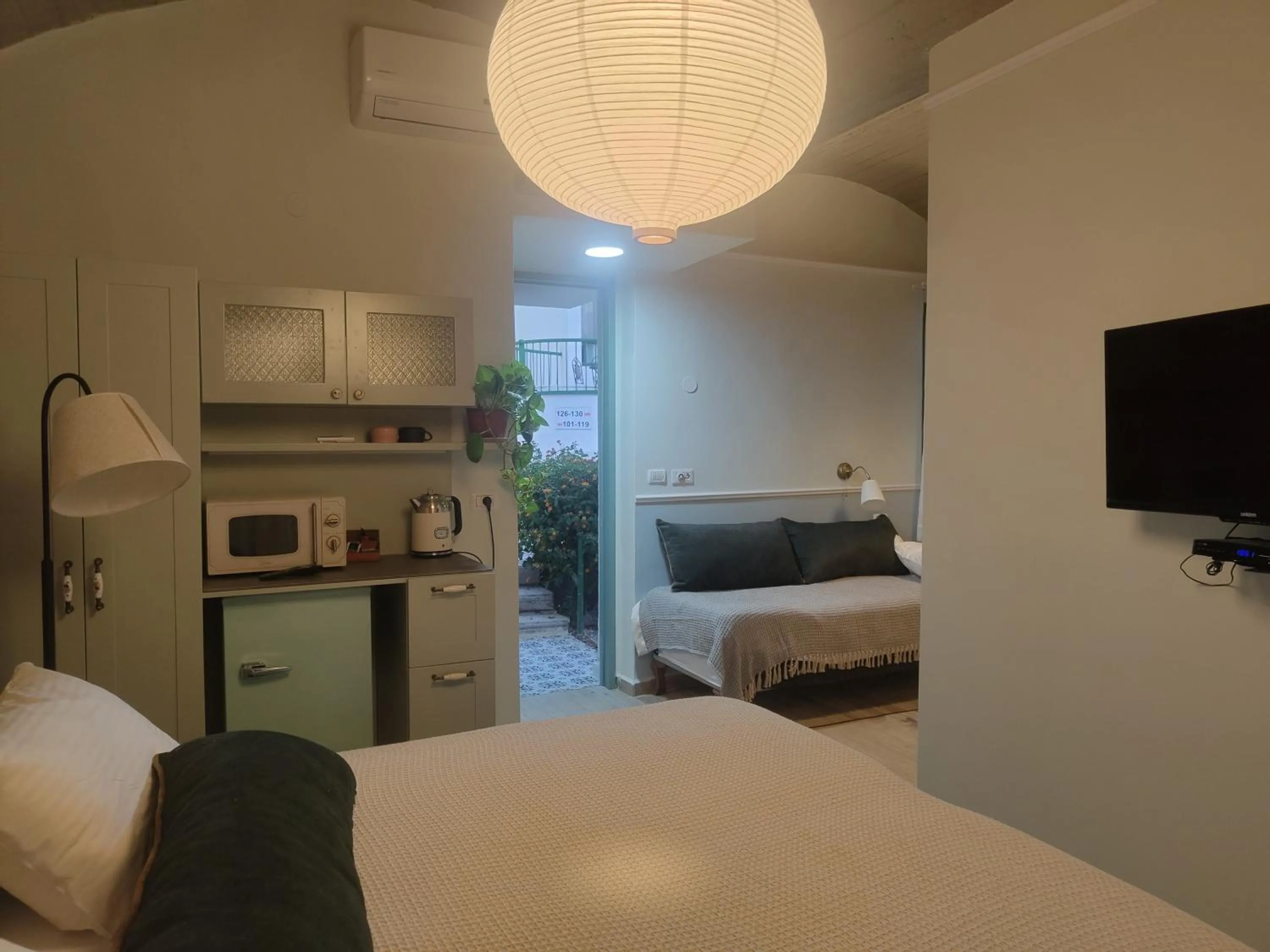 Photo of the whole room, Bed in Neve Shalom Hotel