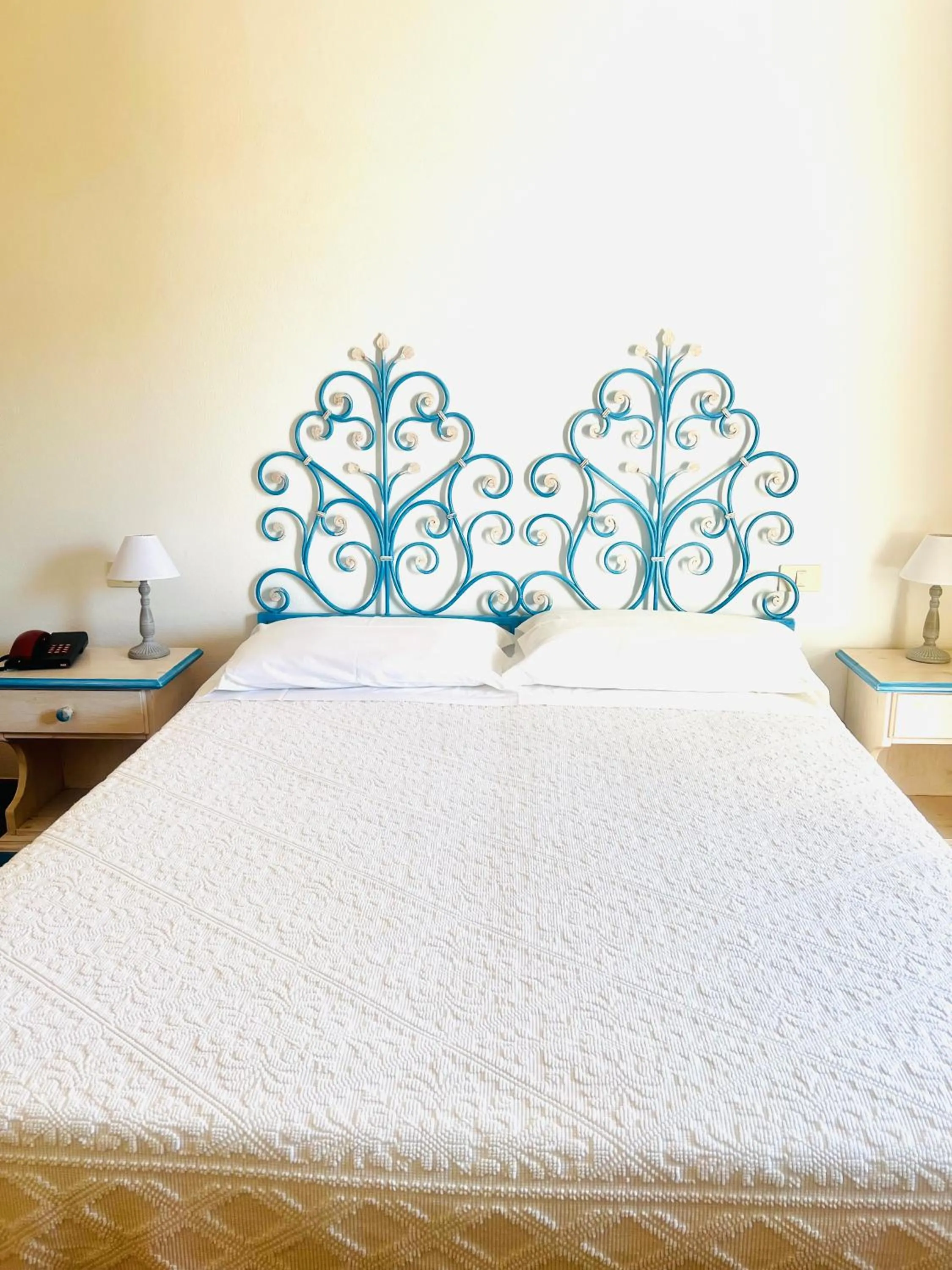 Bed in Hotel Piccolo Pevero