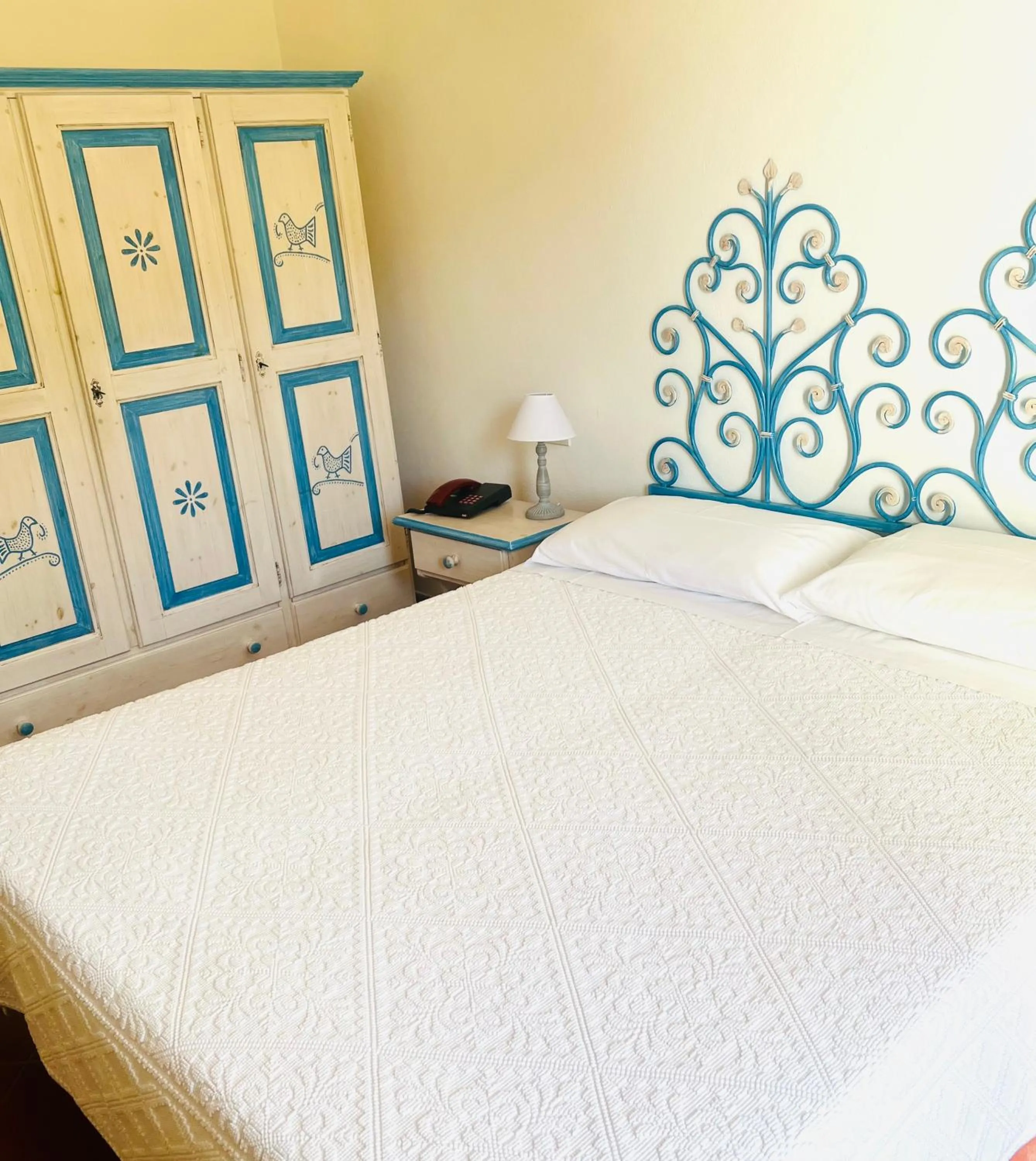 Bed in Hotel Piccolo Pevero