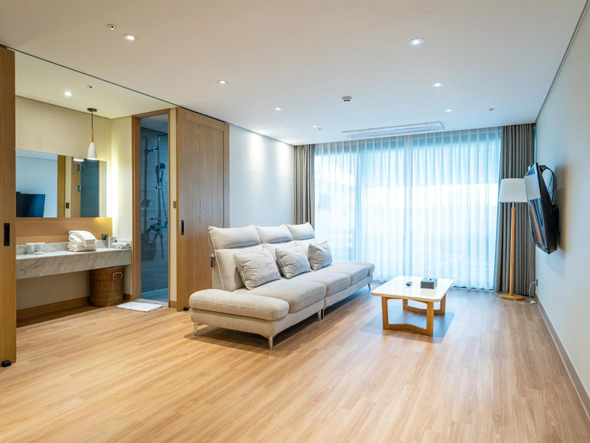 Living room, Bed in Jeju Attirance Hotel & poolvilla