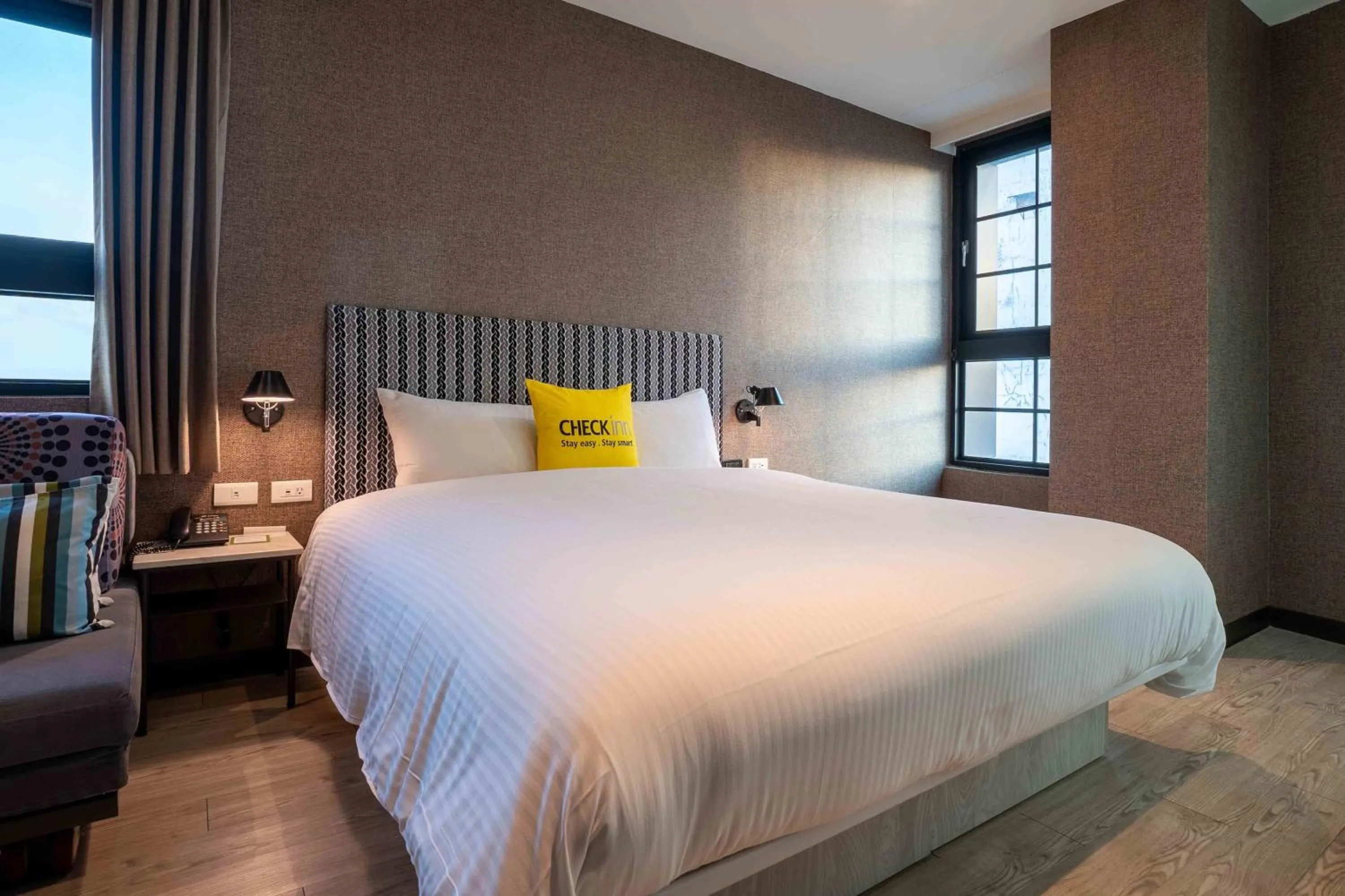 Bed in CHECK inn Taichung Ziyou