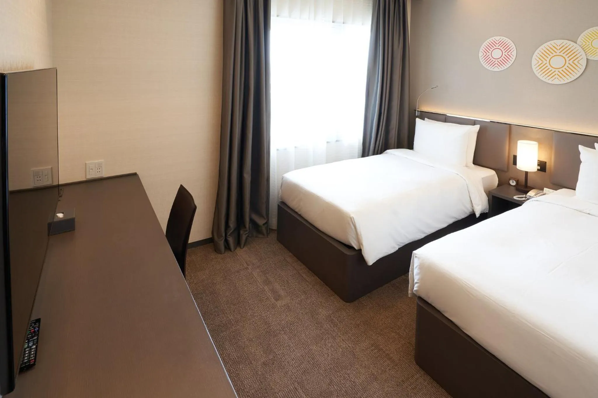 Photo of the whole room, Bed in Holiday Inn & Suites Shin Osaka by IHG