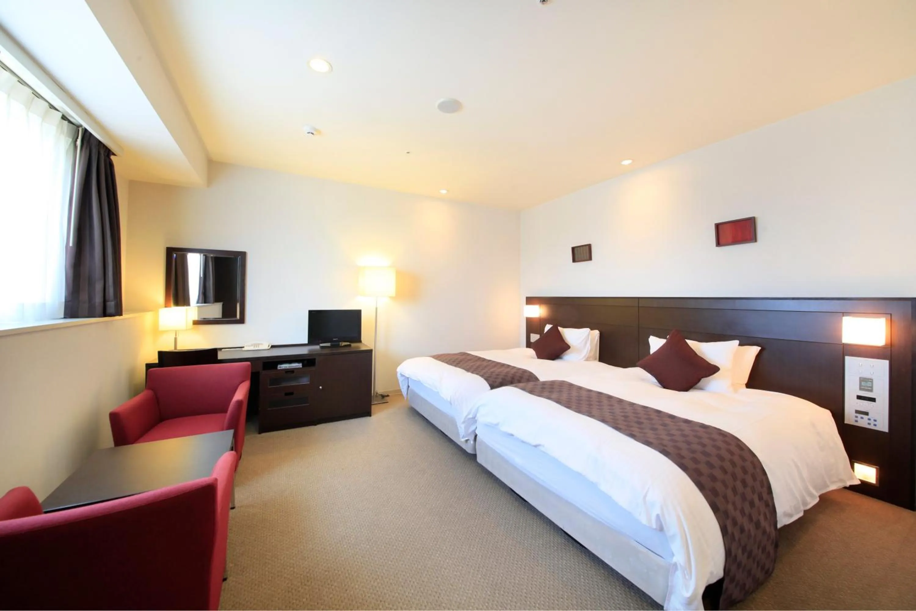 Photo of the whole room, Bed in Quintessa Hotel Sasebo