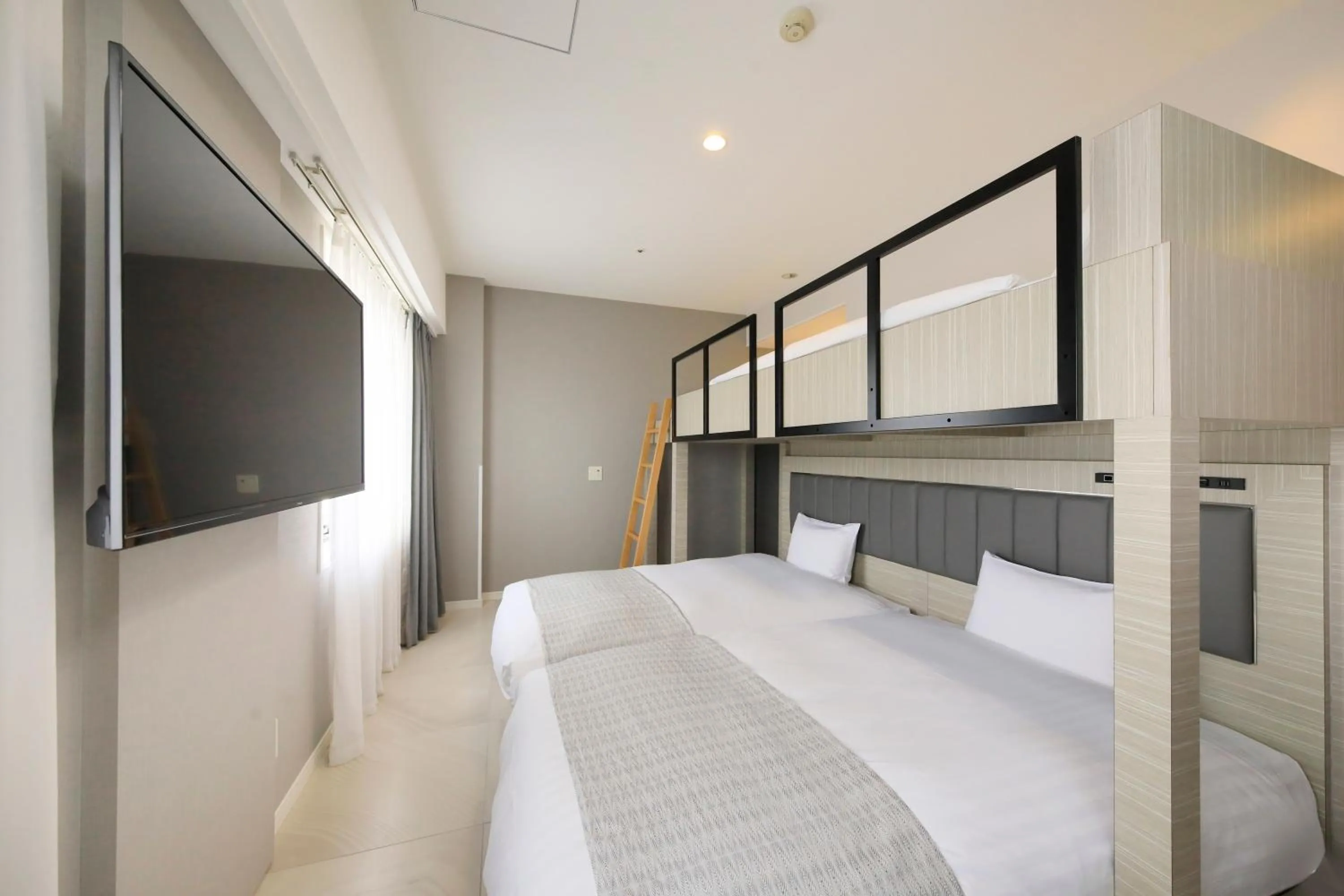 Bed in QuintessaHotel KagoshimaTenmonkan Relax&Sleep