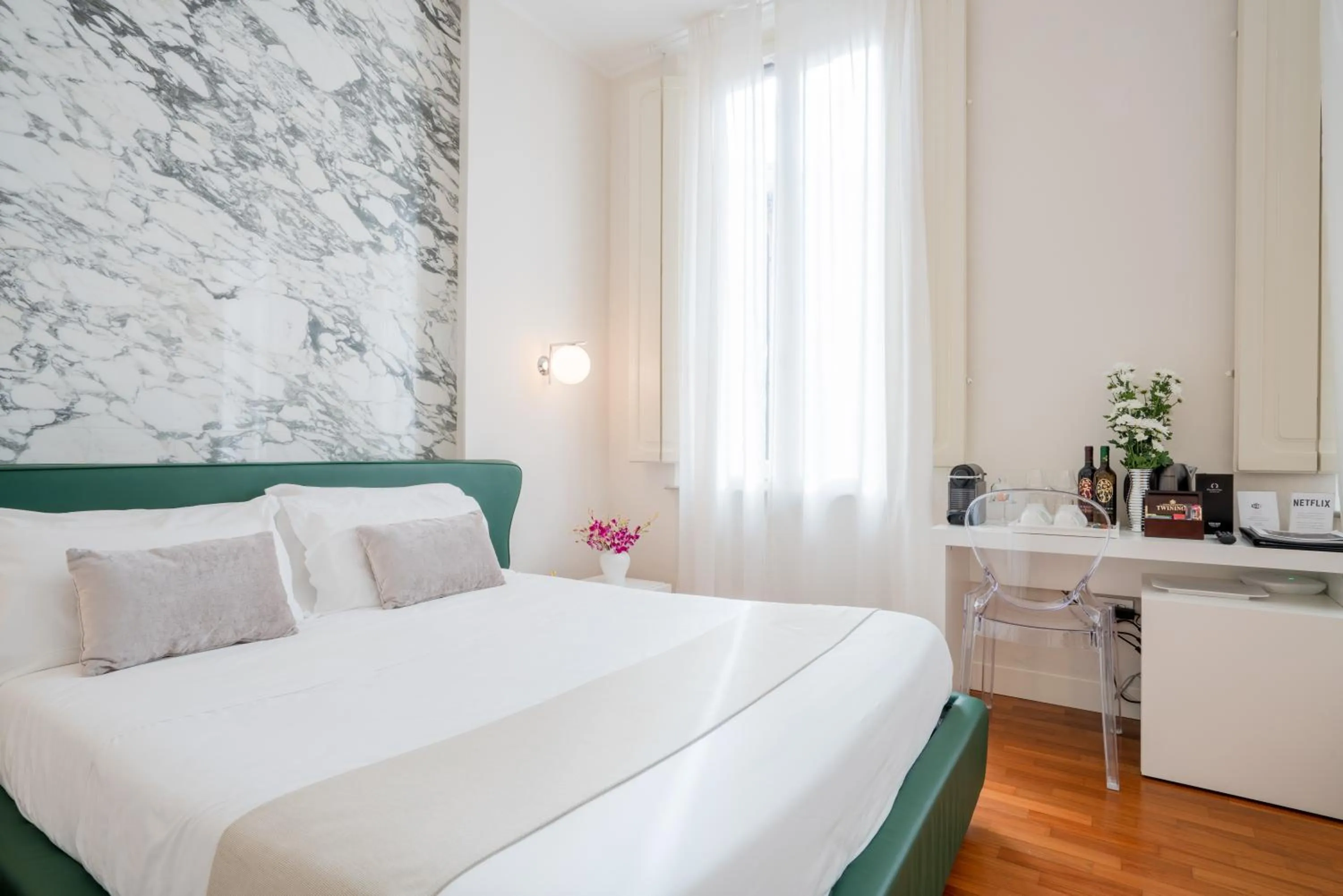 Bed in Palazzo Cini Luxury Rooms in Pisa