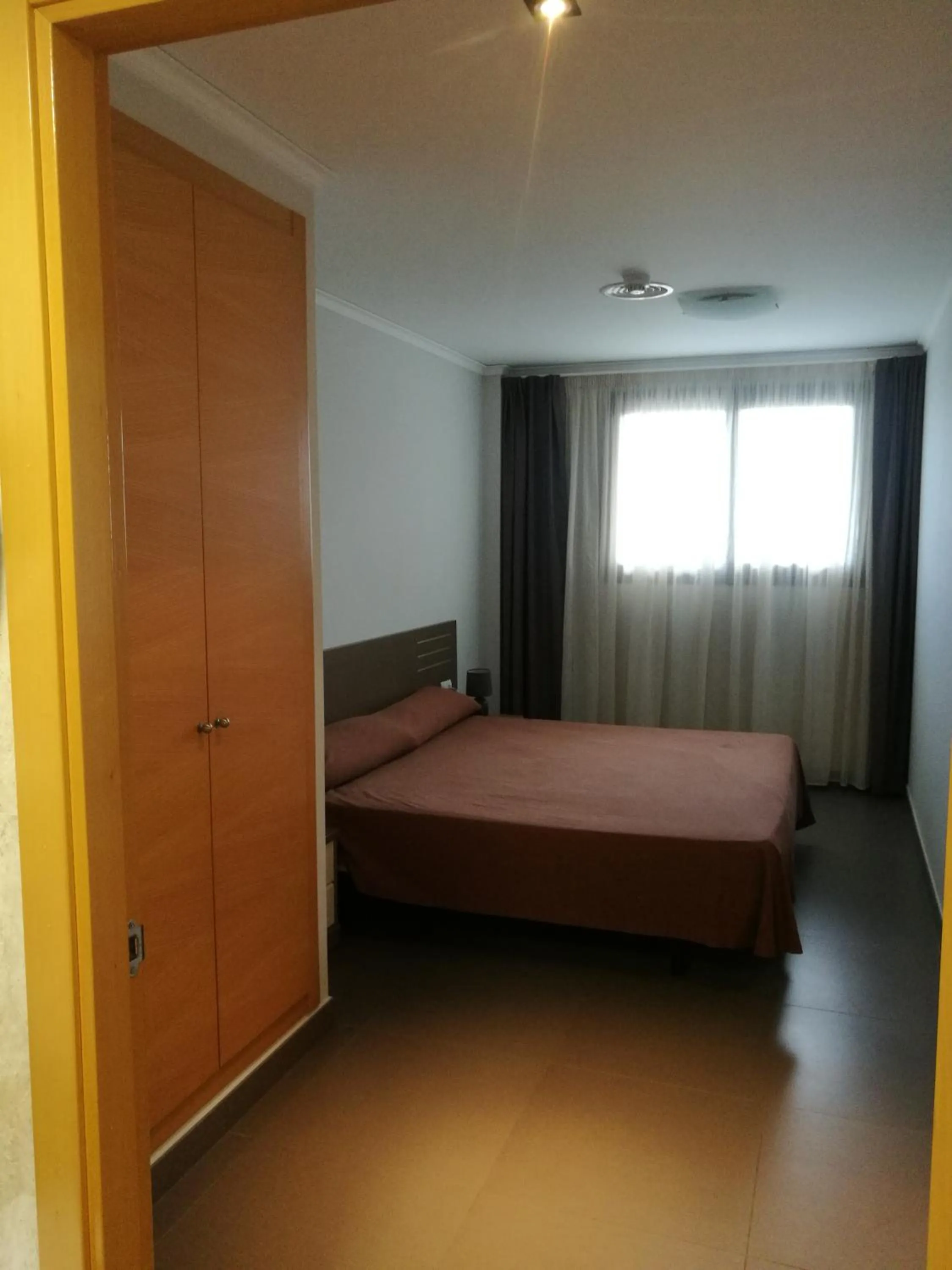 Bed in Aparthotel El Faro