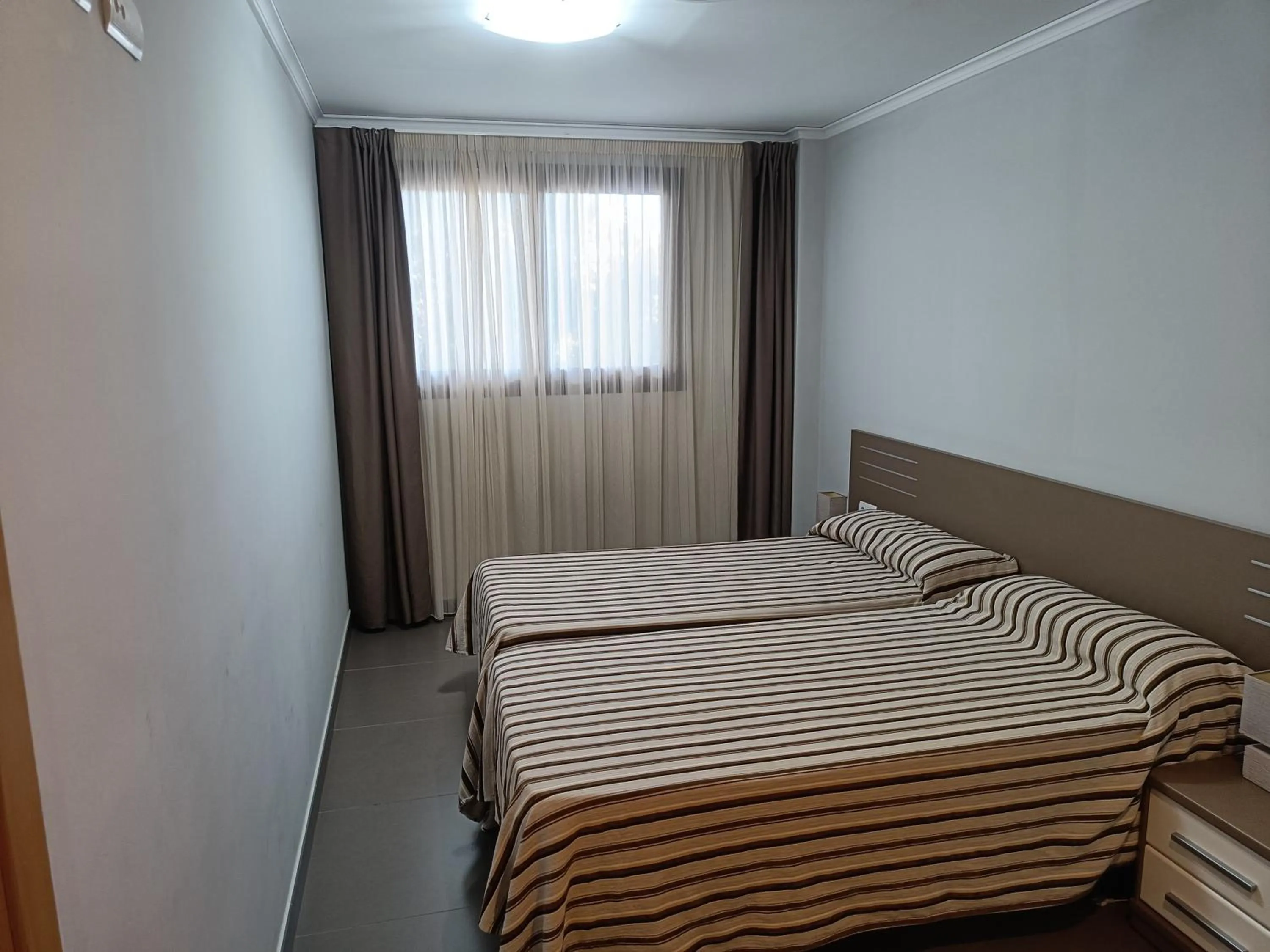 Bed in Aparthotel El Faro