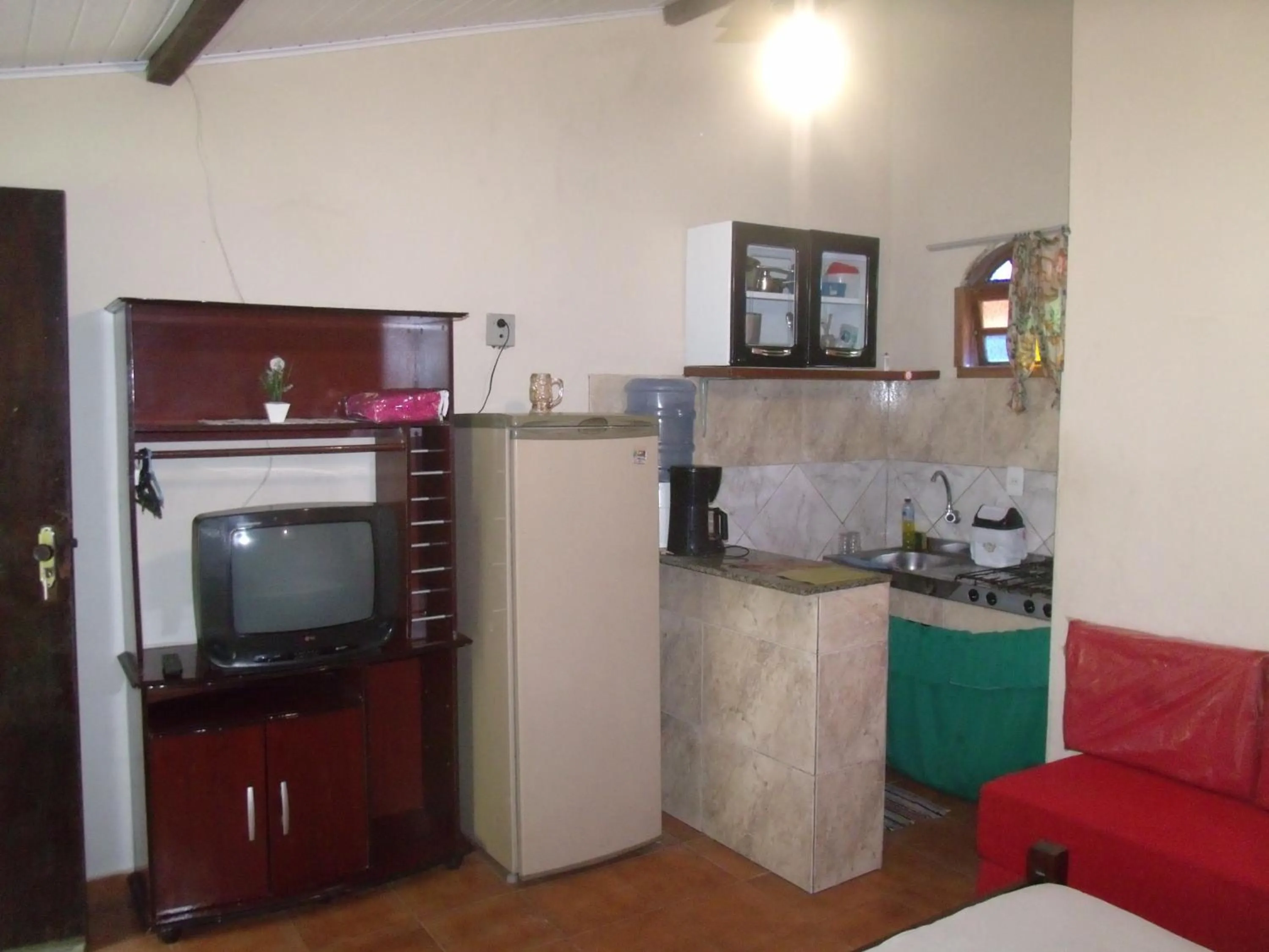 Kitchen or kitchenette in Suítes Brisa Mar
