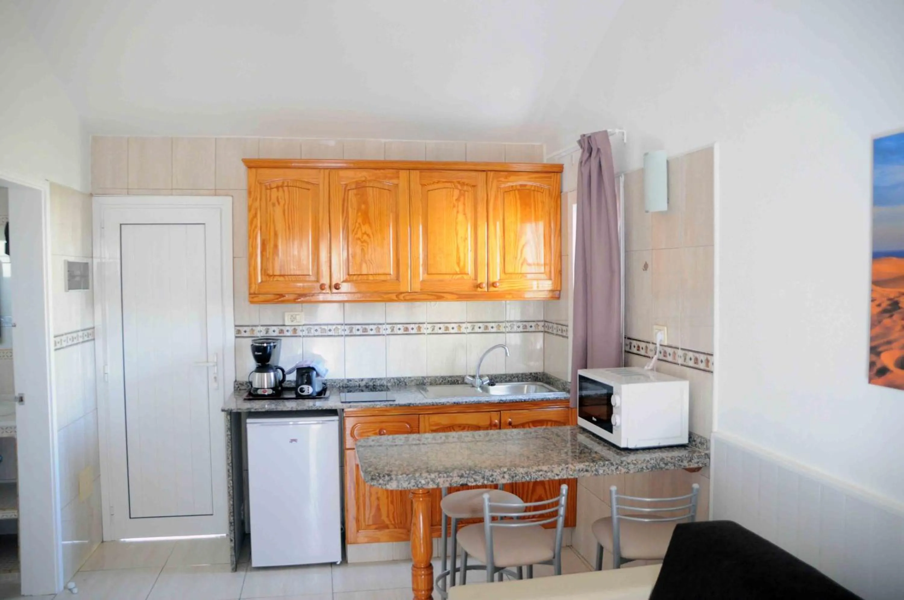 Kitchen or kitchenette in Bungalows Los Arcos