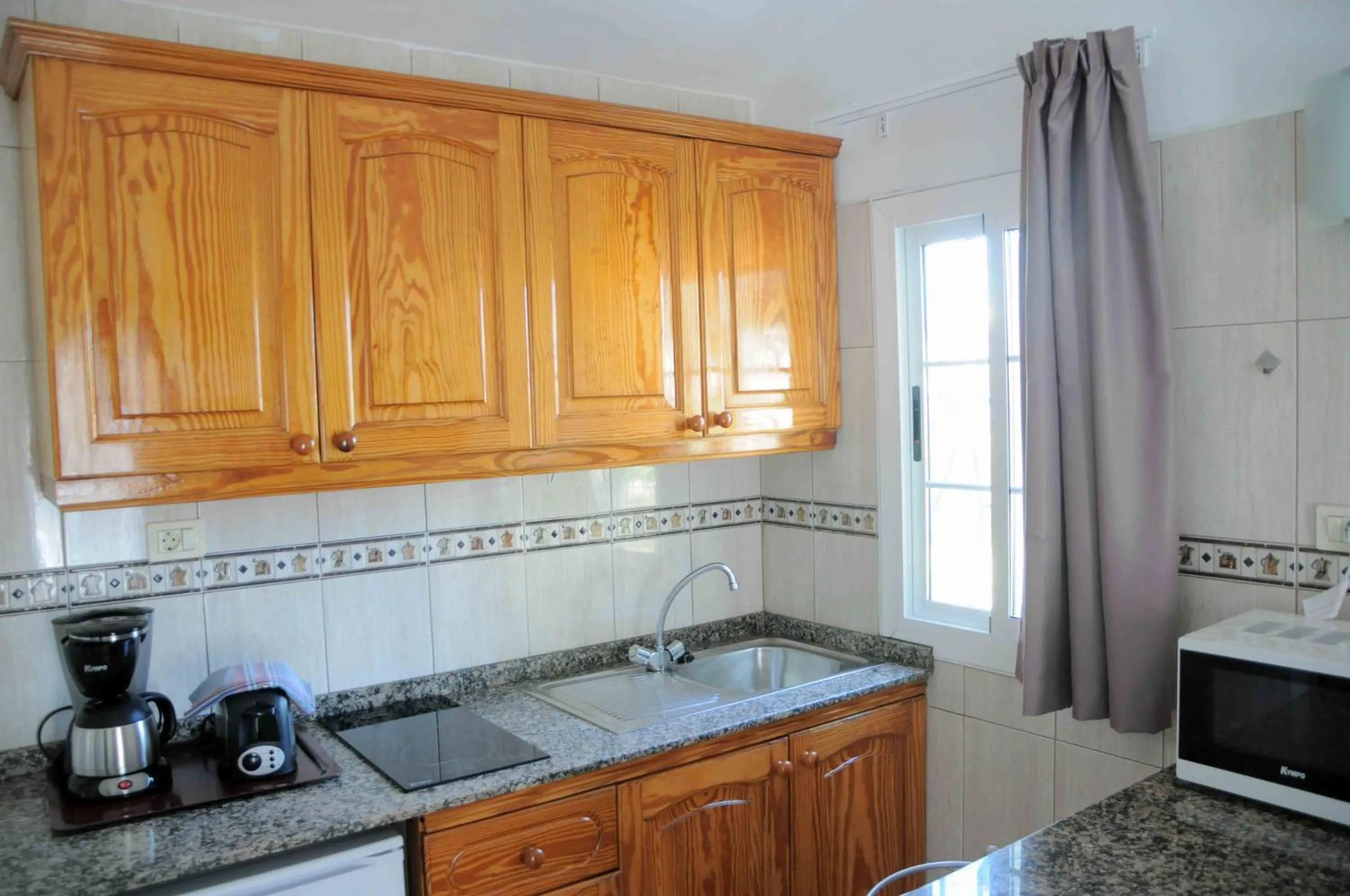 Kitchen or kitchenette in Bungalows Los Arcos