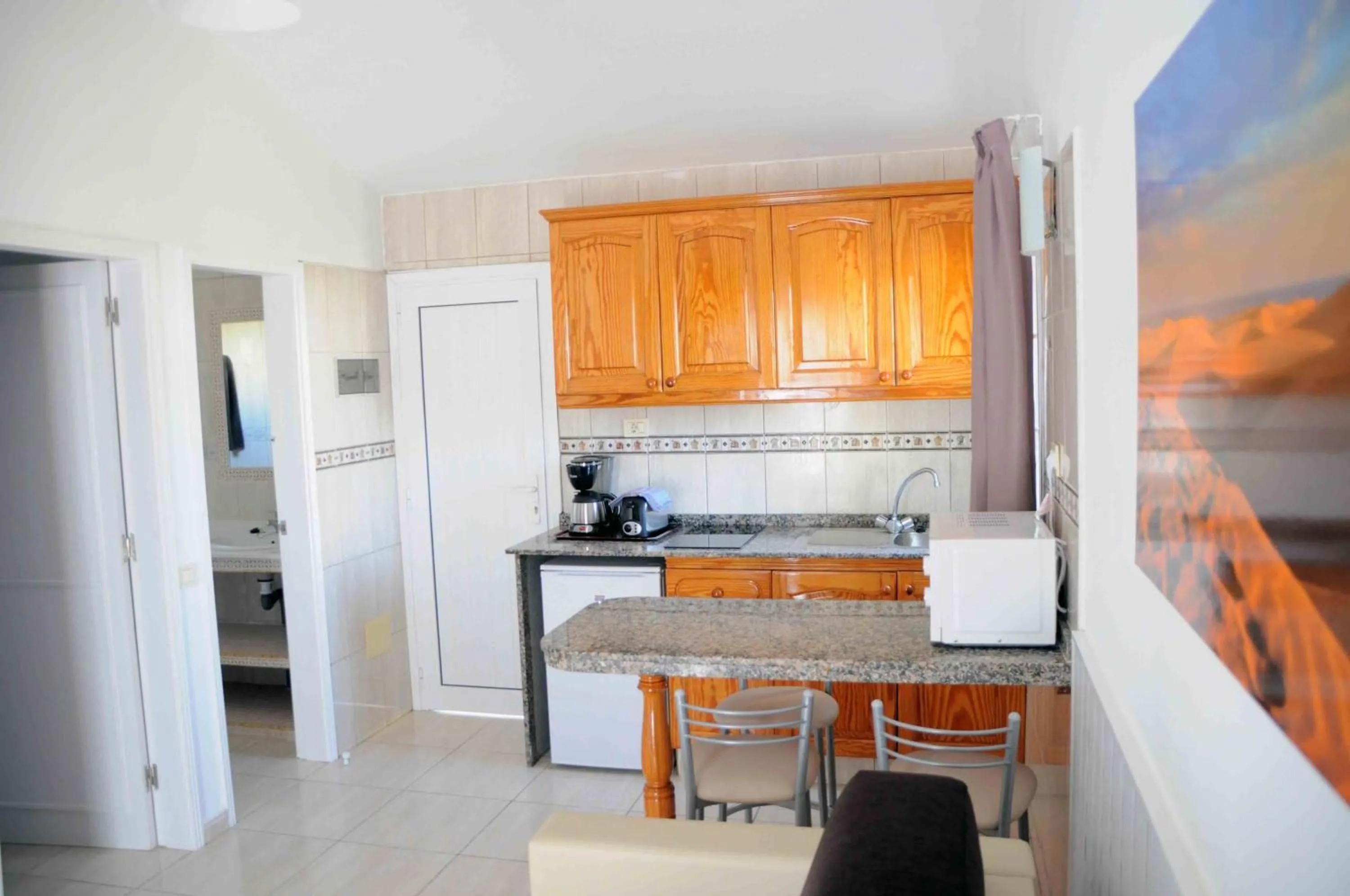 Kitchen or kitchenette in Bungalows Los Arcos