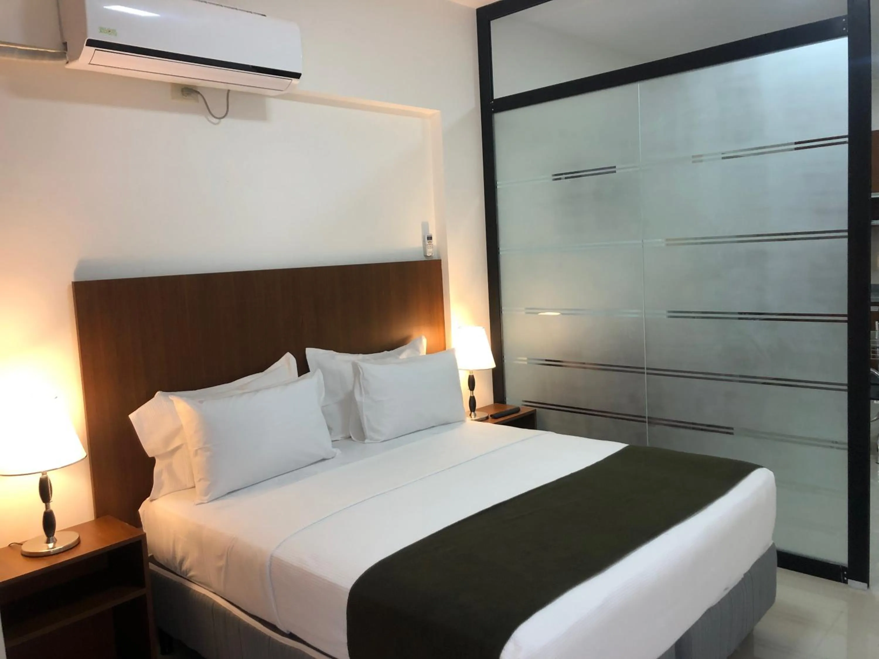 Bed in Pacifico Apart Hotel