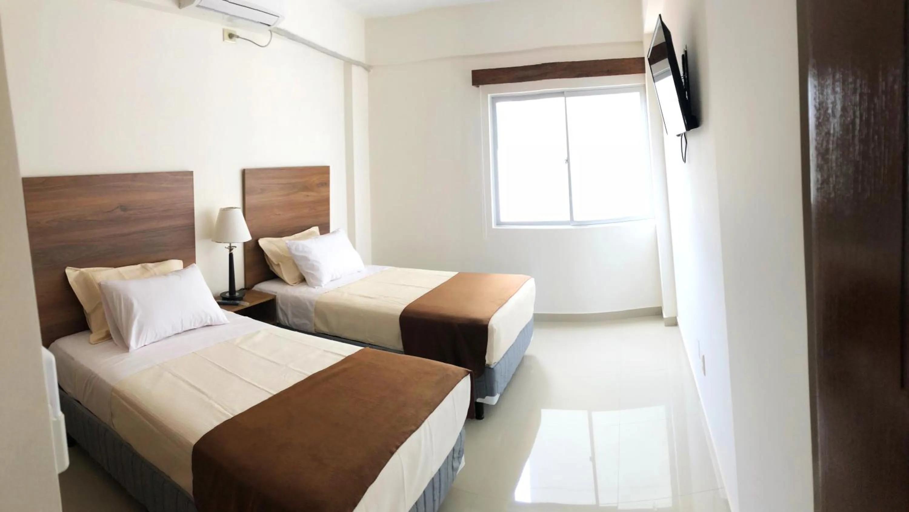Bed in Pacifico Apart Hotel