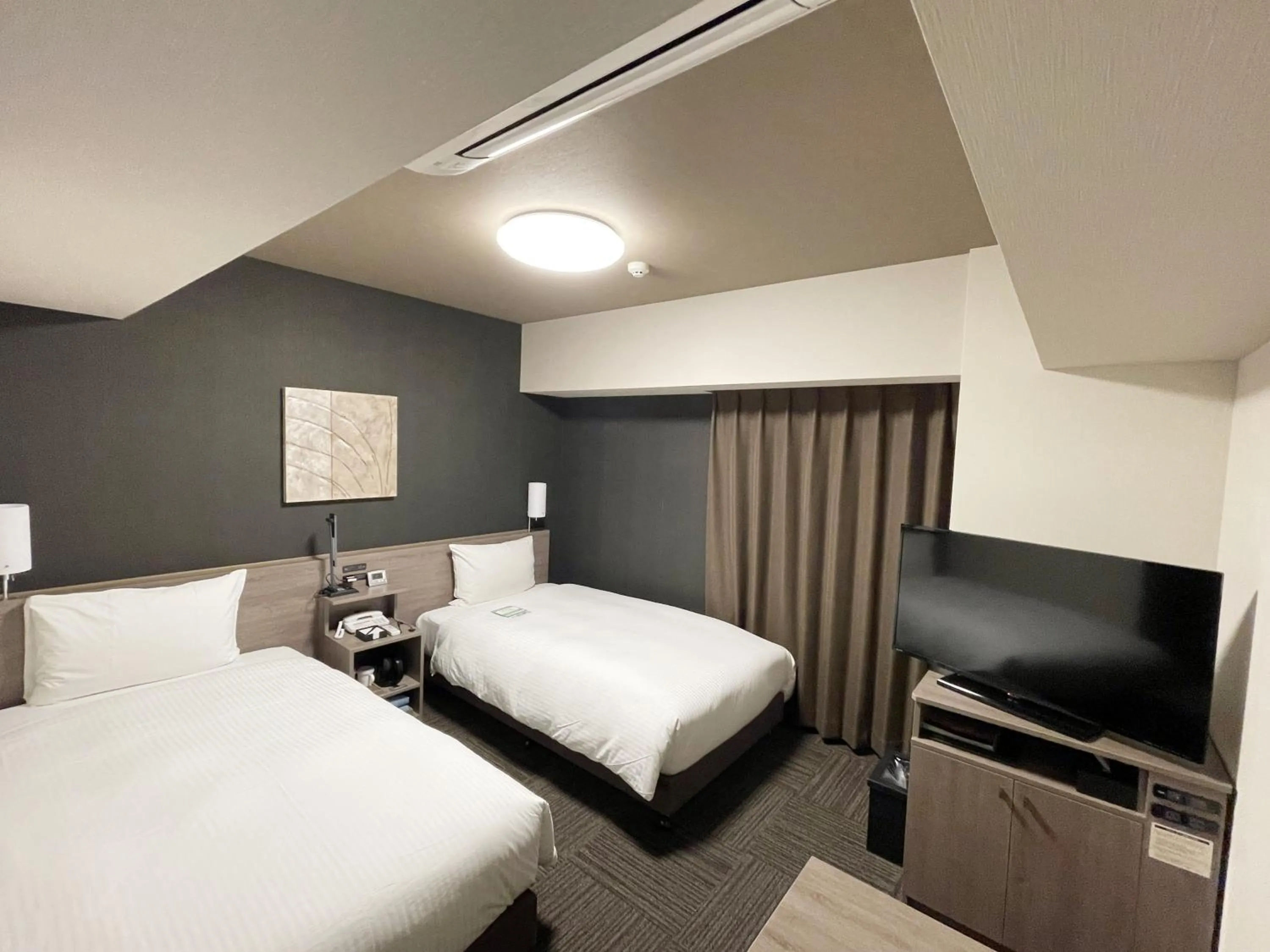 Photo of the whole room, Bed in HOTEL ROUTE-INN Osaka Takaishi -Hagoromo Ekimae-