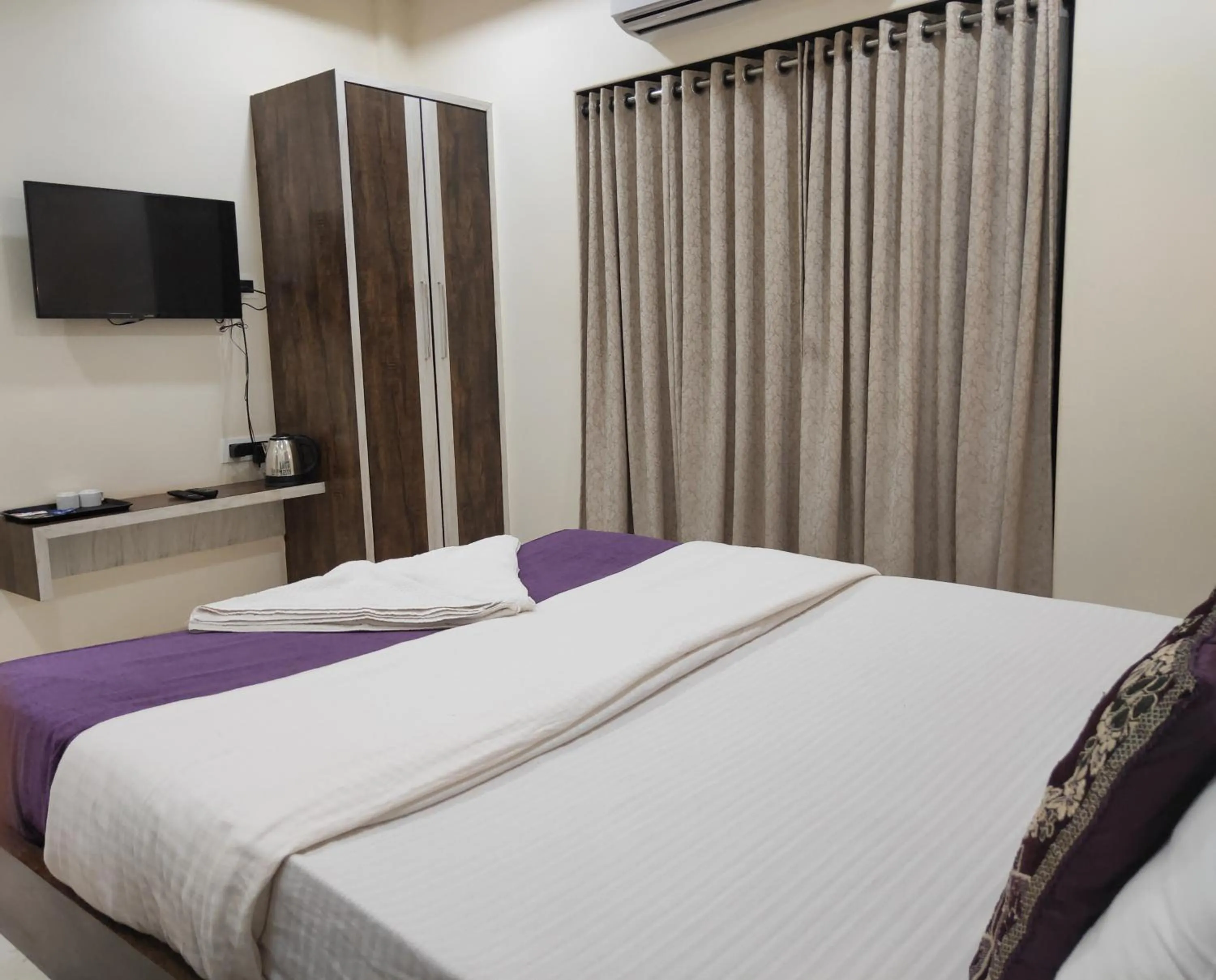 Bed in Hotel Grand Ganesha