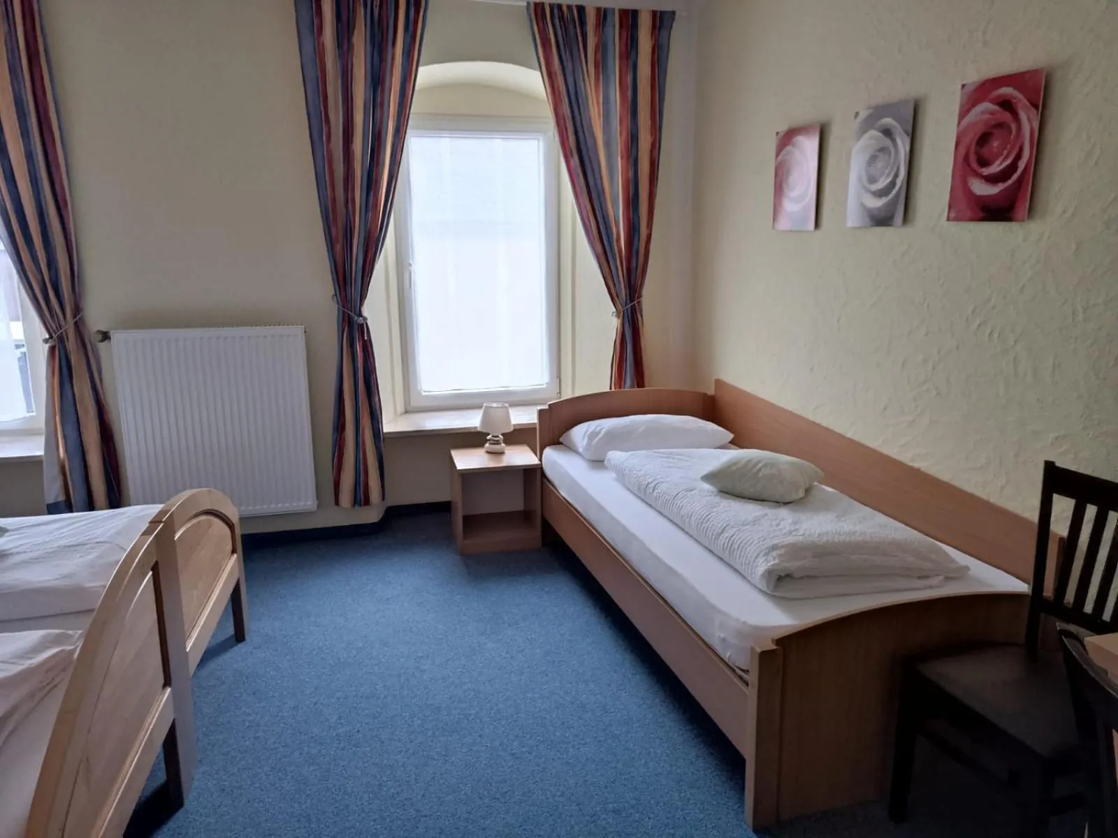 Bed in Garni Hotel Post