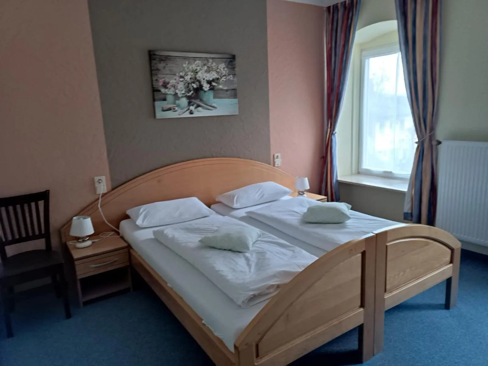 Bed in Garni Hotel Post