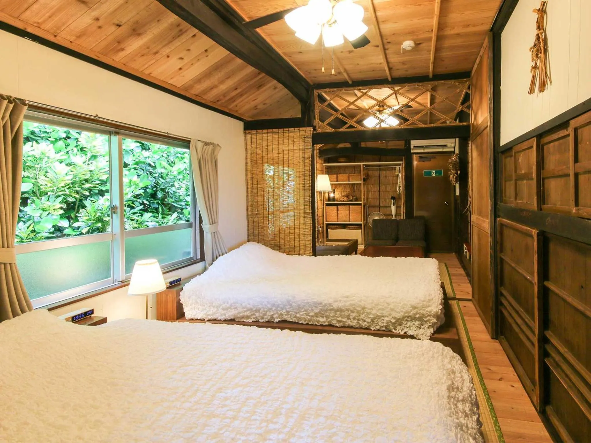 Photo of the whole room, Bed in #Nerome01 Traditional Okinawan House in Ogimi, bc