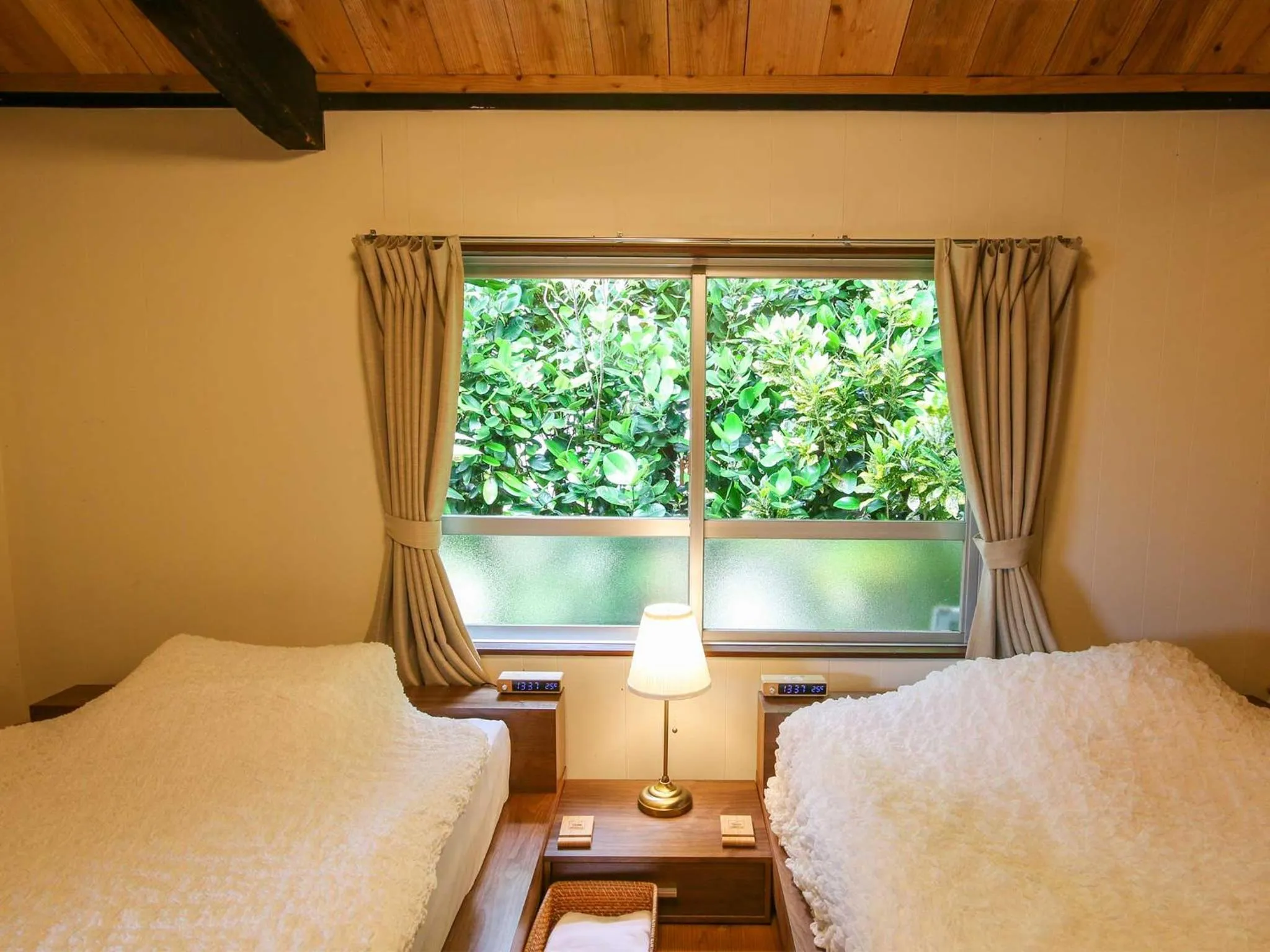 Photo of the whole room, Bed in #Nerome01 Traditional Okinawan House in Ogimi, bc