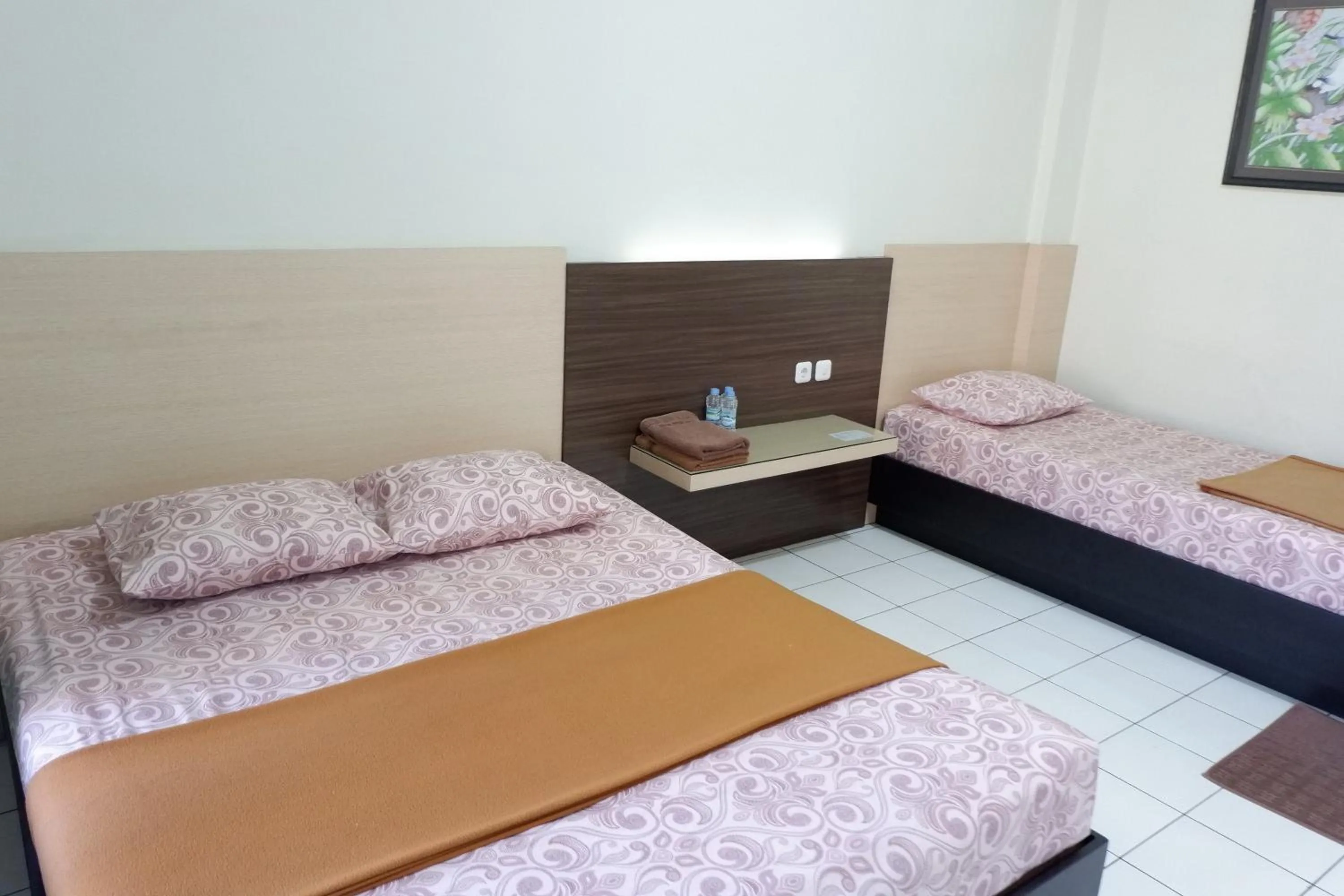 Bed in Hotel Taman Indah