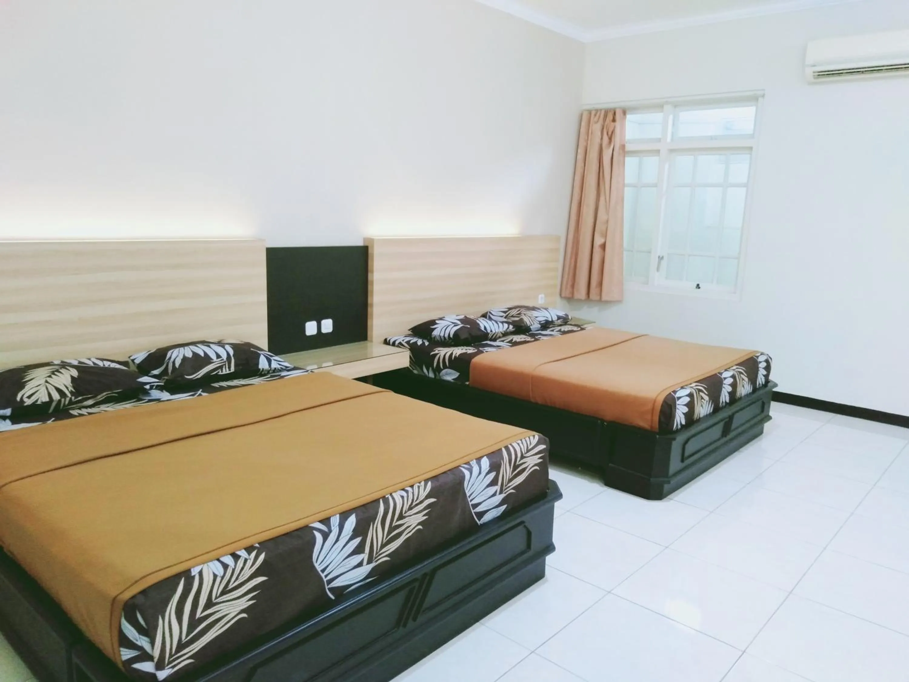 Bed in Hotel Taman Indah