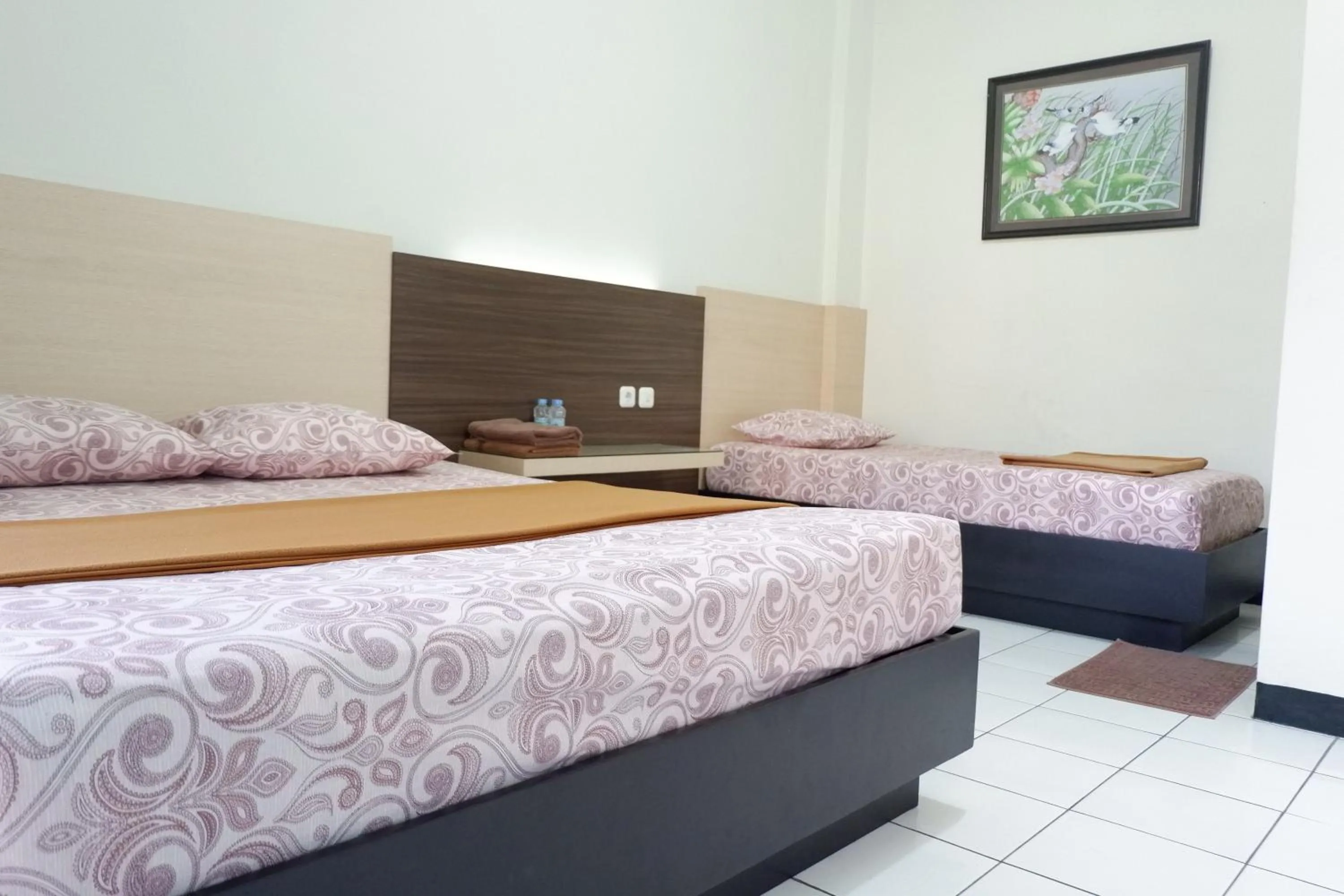 Bed in Hotel Taman Indah