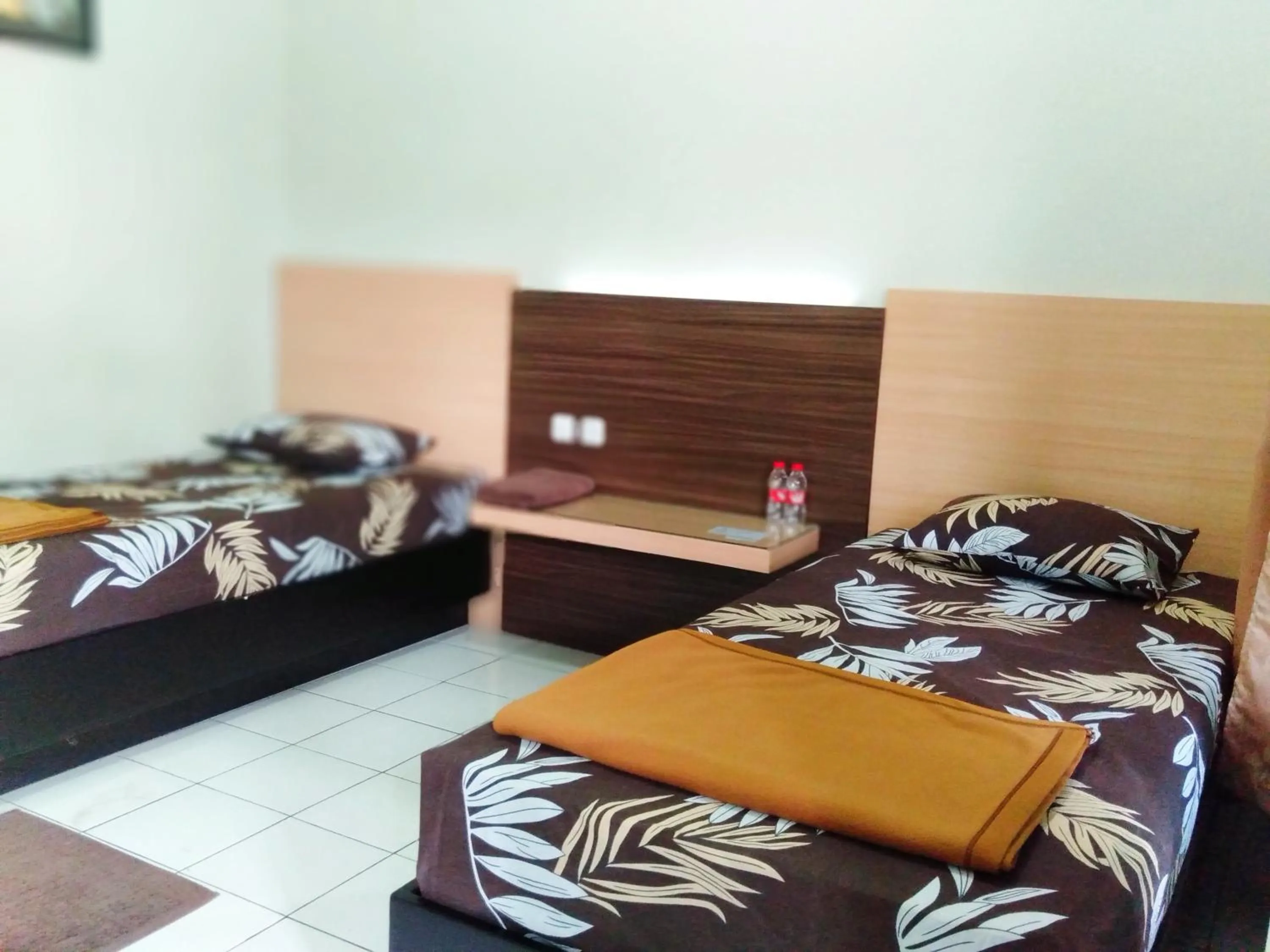 Bed in Hotel Taman Indah