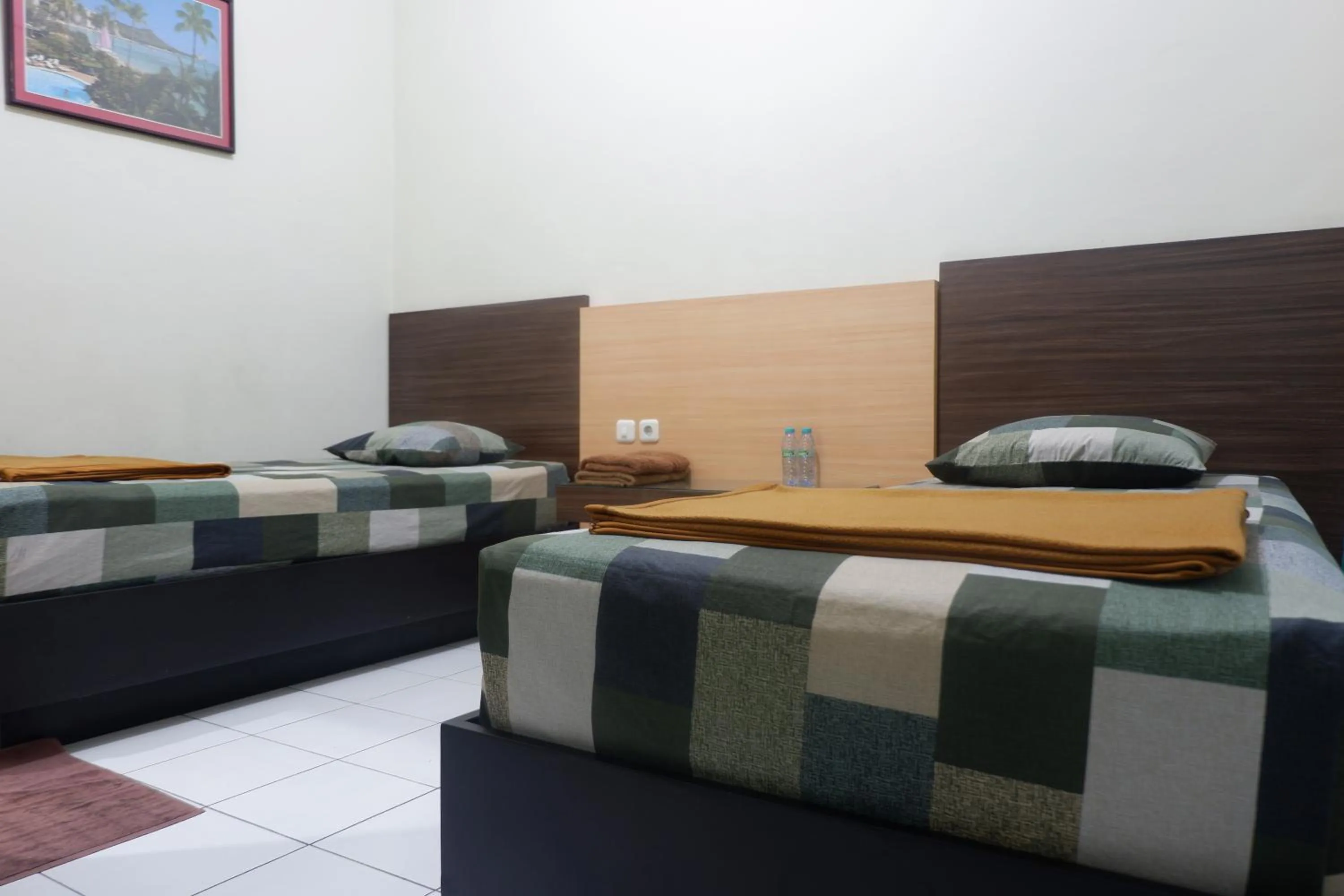 Living room, Bed in Hotel Taman Indah