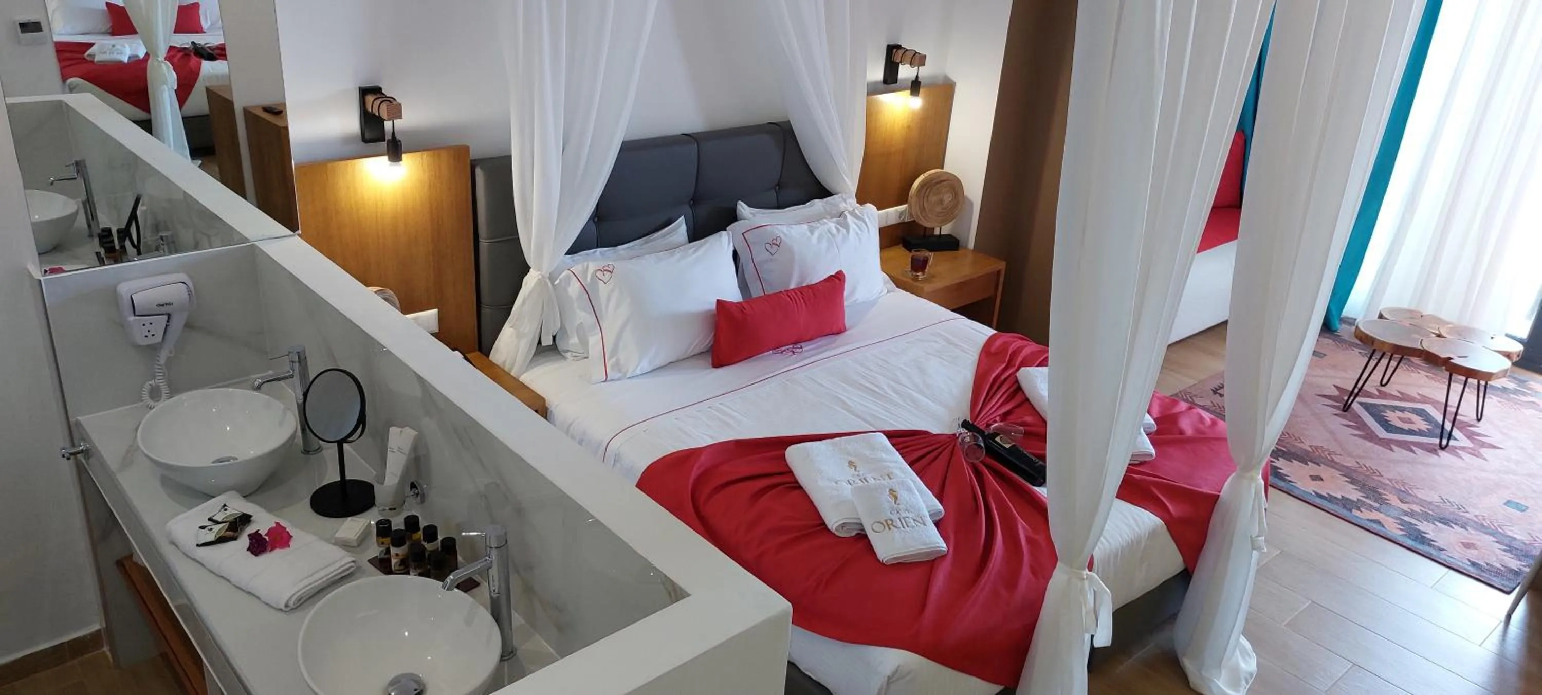 Photo of the whole room, Bed in Cavo Orient Beach Hotel & Suites