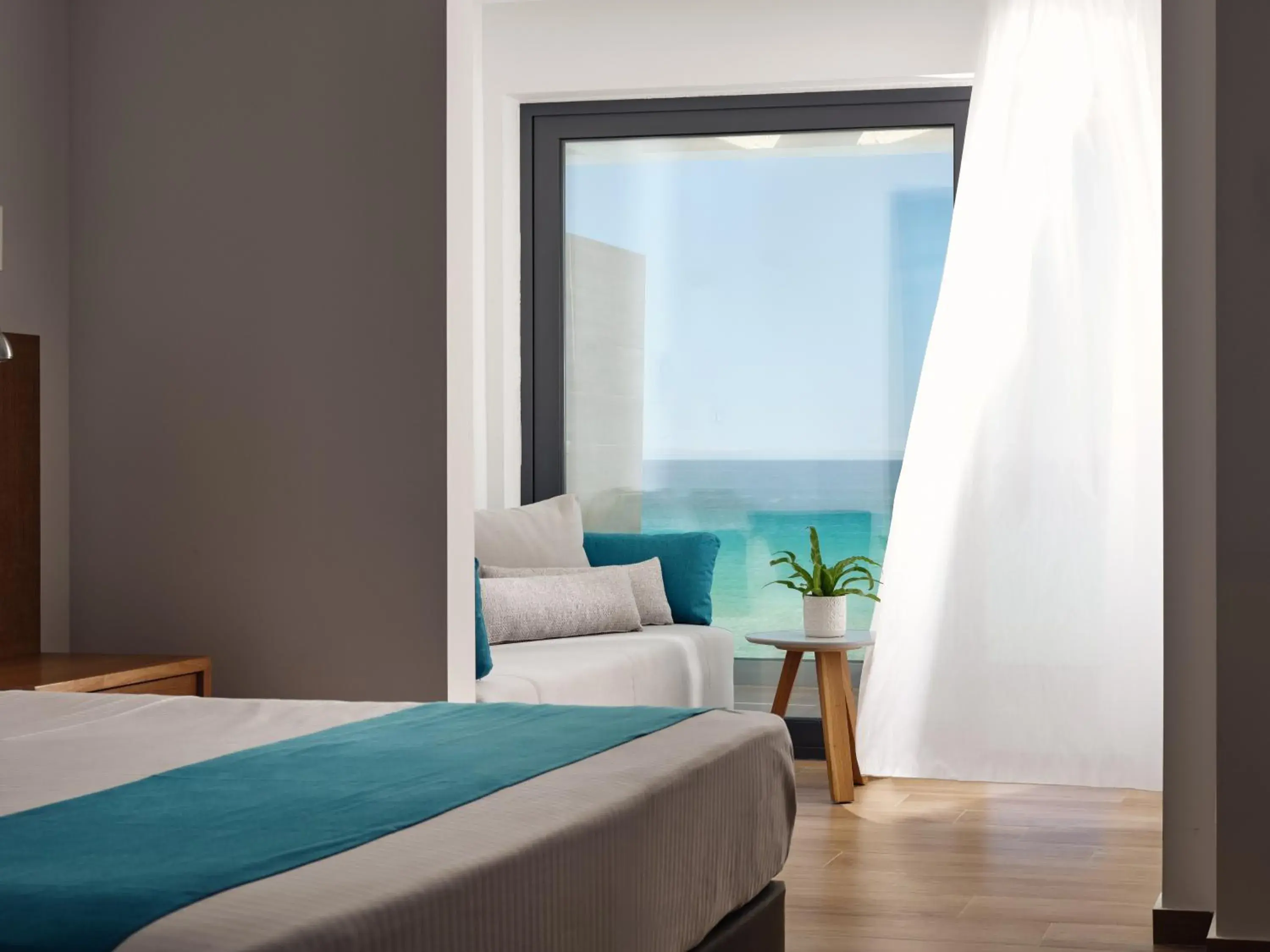 Bedroom, Bed in Cavo Orient Beach Hotel & Suites Bedroom, Bed in Cavo Orient Beach Hotel & Suites