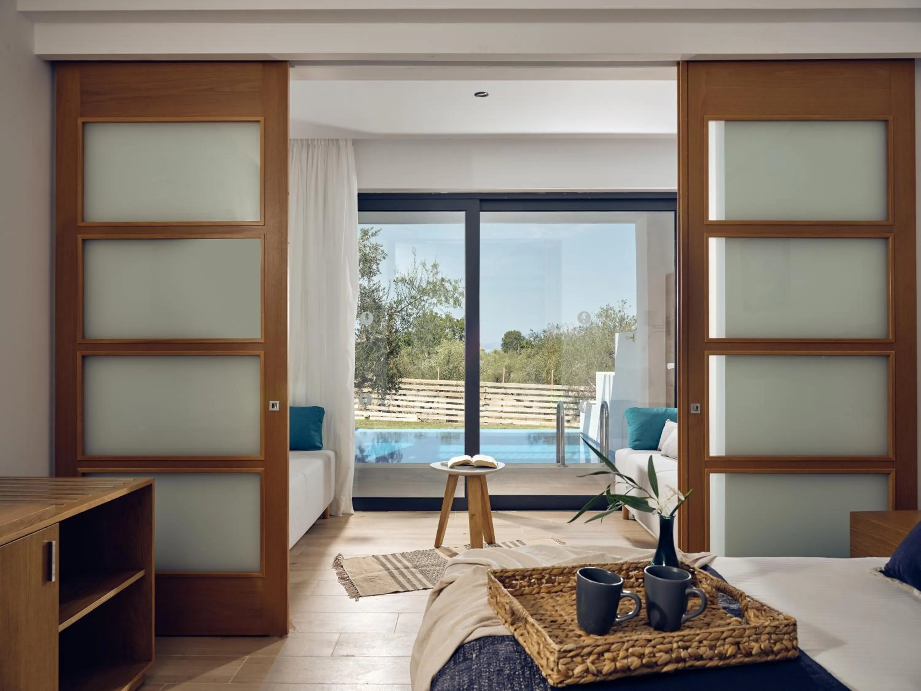 Bedroom, Bed in Cavo Orient Beach Hotel & Suites